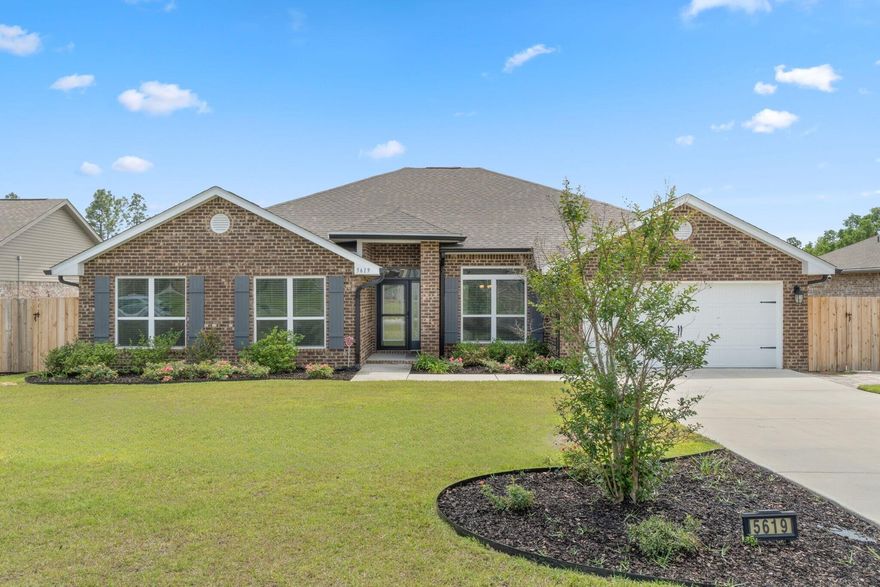 Welcome to your Milton dream home! This BEAUTIFUL, newer construction, 4 bedroom, 3 full bathroom home in the Hamilton Crossing neighborhood is move-in-ready and features tons of seller updates and thoughtful touches throughout - Starting with the front landscaping for excellent curb appeal. One of the standout features of this home is the propane powered full-house Generac generator, ensuring you're never without power - an excellent perk for Florida living. Inside, you'll find an open concept floor plan with modern finishes, spacious living area, dining room, separate breakfast nook, and a well-appointed kitchen for entertaining. The generous sized chef's kitchen offers plenty of counter and cabinet space, stainless steel appliances, and a large walk-in pantry right as you walk  in the  laundry room. The GORGEOUS custom deck and terraced backyard sets the perfect scene for a fantastic outdoor entertaining space with a fully fenced in backyard, as well as a screened in patio. The primary suite features a spa-like ensuite with garden tub and updated walk-in shower, 2 walk-in closets, water closet, and a double vanity. Down the hall you'll find the additional 3 bedrooms and 2 full bathrooms, as well as hall closets for additional storage space. Schedule your showing today, and come see this solid smart home!