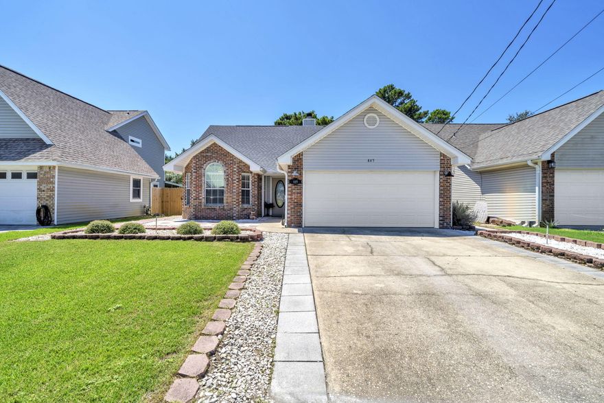 Welcome Home! Just minutes from Hurlburt Air Force Base, this spacious and inviting property offers both comfort and convenience.Step inside to a bright, open living area featuring vaulted ceilings, recessed lighting, and a cozy gas/wood-burning fireplace. The kitchen is a chef's delight with cathedral ceilings, abundant counter space, ample cabinetry, a breakfast bar, and a charming breakfast nook framed by a bay window that floods the space with natural light. Modern stainless steel appliances and a stunning backsplash complete the look.Sliding glass doors open to a private patio--perfect for grilling out, entertaining, or simply enjoying family time. Tucked away in a quiet, low-traffic neighborhood, this home still keeps you close to shopping, schools, the water, and more. This home has it allspace, style, and location!