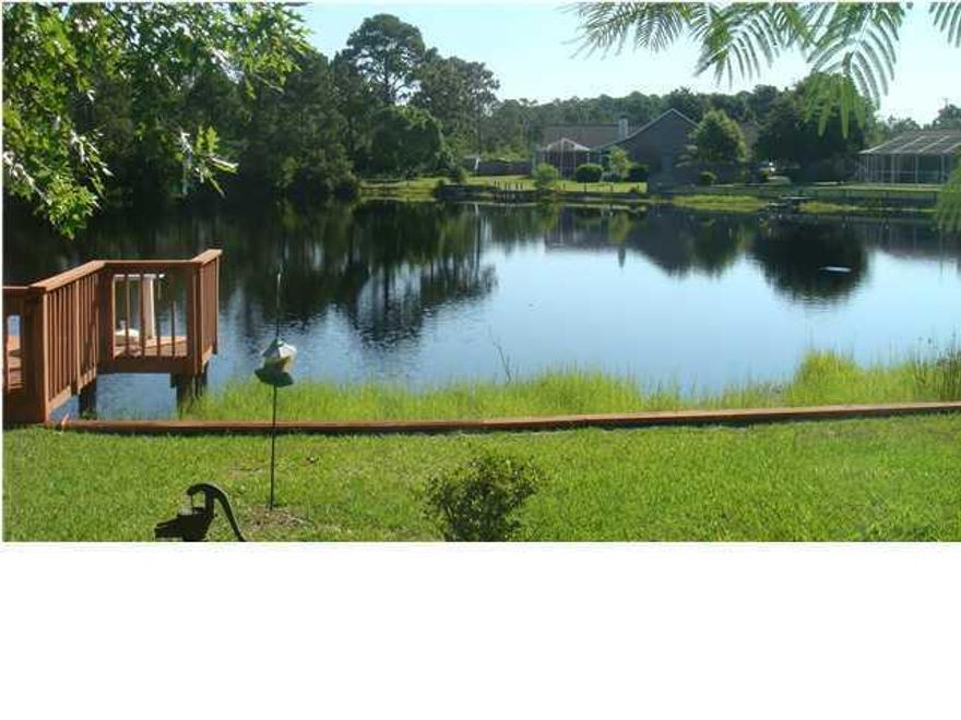 JUST REDUCED. Priced To Sell!!! Rare find beautiful Lakefront home. You wont find a home on the Lake priced this low. Move In ready. Large open family room with valted ceiling and brick fireplace. Hurricane window coverings. Whole house Air purifier. Large maser bedroom with walk-in closet. Fresh paint throughout. Spectacular views of the Lake from spacious enclosed back porch. Tile flooring throughout except two bedrooms have carpeting.Whole house Generac brand Generator. $4500 allowance for carpet, updates or closing costs with full priced offer. Chain link and privacy fenced back yard.