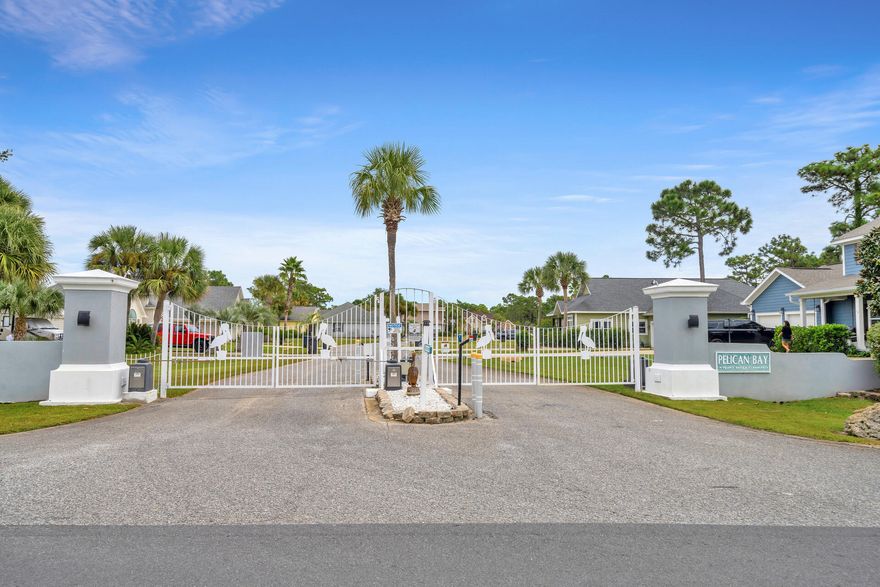 This is your opportunity to own one of the few remaining lots in the beautiful, bay front community of Pelican Bay. In addition to the front entrance, this property offers a unique option for access from the rear of the lot off of E. Mack Bayou Road. The back access route opens up exciting possibilities for additional entrance, parking areas, or even a secondary building such as a workshop or garage. This dual access sets this property apart, providing flexibility for your design and land usage. Don't miss out on this fantastic opportunity to create your ideal property. Pelican Bay amenities include a tennis and pickle ball court, bay front park , dock to fish, pull your boat up for loading and unloading, drop your kayak or paddle board in, or just take a swim in the bay. All of this with LOW HOA fees. Near shopping, restaurants and entertainment at Grand Boulevard, as well as the hospital and just minutes to the beach. This lot is one not to pass up. Are you ready to build your dream home?