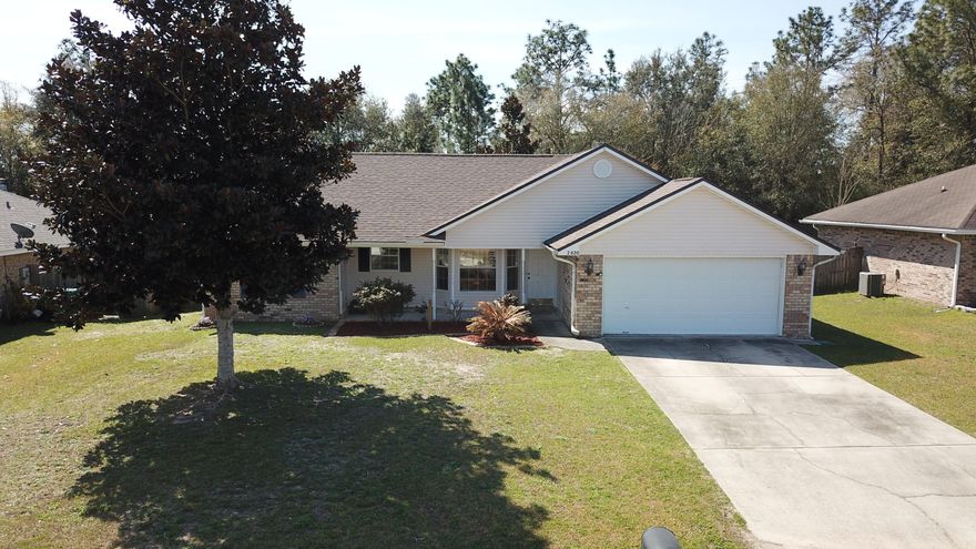 Looking for a cute home South end of Crestview, easy access to Eglin, Duke, Hurlburt AFB? Well look no more here it is! This cute 3 bed 2 bath has everything you need including a new roof installed in January. The kitchen is open into the living room with beautiful custom cabinets. Split bedroom design. Master Bath is equipped with double vanity and a garden tub to relax in at the end of a long day. Tile, laminate wood floors & fresh paint throughout. Large, fenced back yard overlooking woods for added privacy. 2 to 5 minutes walk there is a lake nearby that can be used for fishing. Catch & release only but kids & parents seem to enjoy it. Close to everything & less then 45 minutes from the Panhandles beautiful beaches so call now for an appointment & don't forget to check out the video!