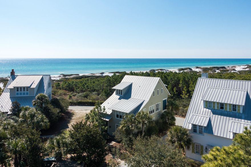 One of the finest homes in the Watercolor Community, 105 Park Row Lane is located in the highly sought after Gulf District. It overlooks the rare beauty of the area coastal dunes as well as the Gulf of Mexico. It takes less than a minute to walk to the renowned WaterColor BeachClub and access the turquoise waters and white sand beaches. The back of this professionally decorated home borders Grayton State Park, making the covered deck that runs the length of the house private. Design features include: black walnut custom cabinetry and floors, built in whole house stereo system, custom closet systems, mahogany framed windows and doors and an alarm system.