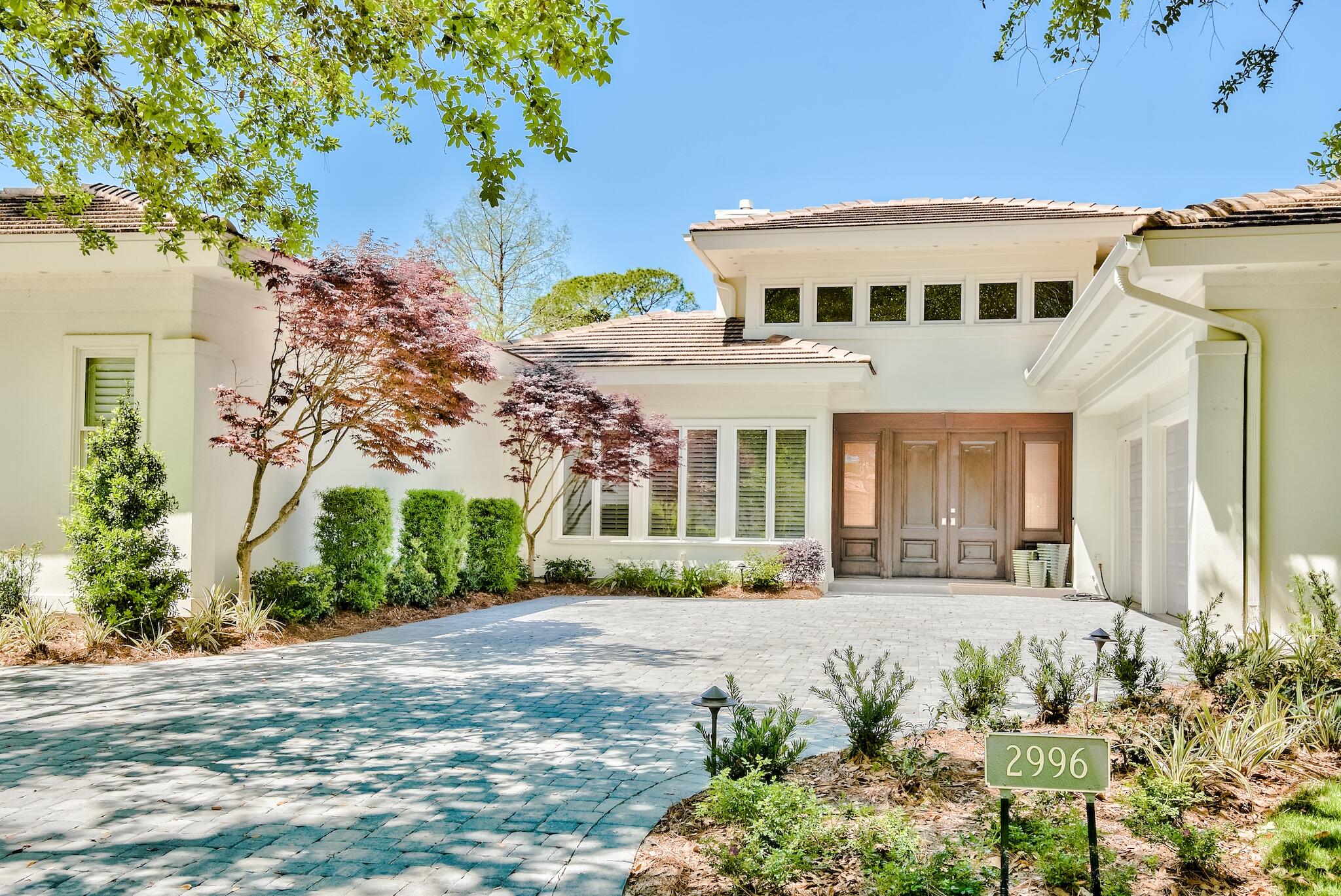 Want your HGTV moment but none of the work? This stunning Bay Villas fully renovated home is tucked away in the exclusive Burnt Pine gated neighborhood with renovations that would make Chip and Joanna jealous. Single story living with a split floor plan creates ease of use. The oversized great room with high ceilings perfectly overlooks the private pool/spa and lake. There is a cozy dining area adjacent to the chef's kitchen, The kitchen is complete with premium appliances including Viking refrigerator and Bertazonni range and includes island seating and pantry storage. The primary suite and home office with fireplace occupy one side of the home while two guest suites share a jack and jill bath with dual vanities on the other plus a laundry room and half bath.