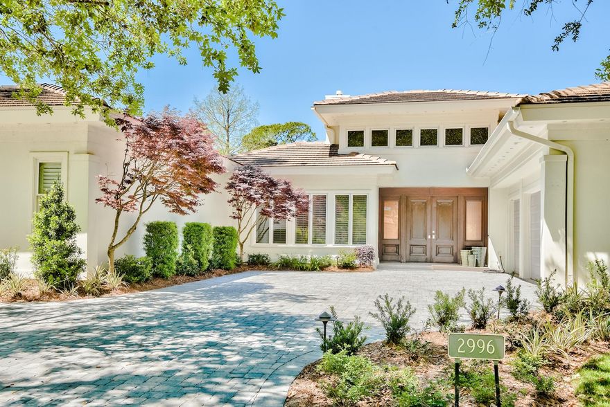 Want your HGTV moment but none of the work?  This stunning Bay Villas fully renovated home is tucked away in the exclusive Burnt Pine gated neighborhood with renovations that would make Chip and Joanna jealous. Single story living with a split floor plan creates ease of use.  The oversized great room with high ceilings perfectly overlooks the private pool/spa and lake. There is a cozy dining area adjacent to the chef's kitchen,  The kitchen is complete with premium appliances including Viking refrigerator and Bertazonni range and  includes island seating and pantry storage. The primary suite and home office with fireplace occupy one side of the home while two guest suites share a jack and jill bath with dual vanities on the other plus a laundry room and half bath.