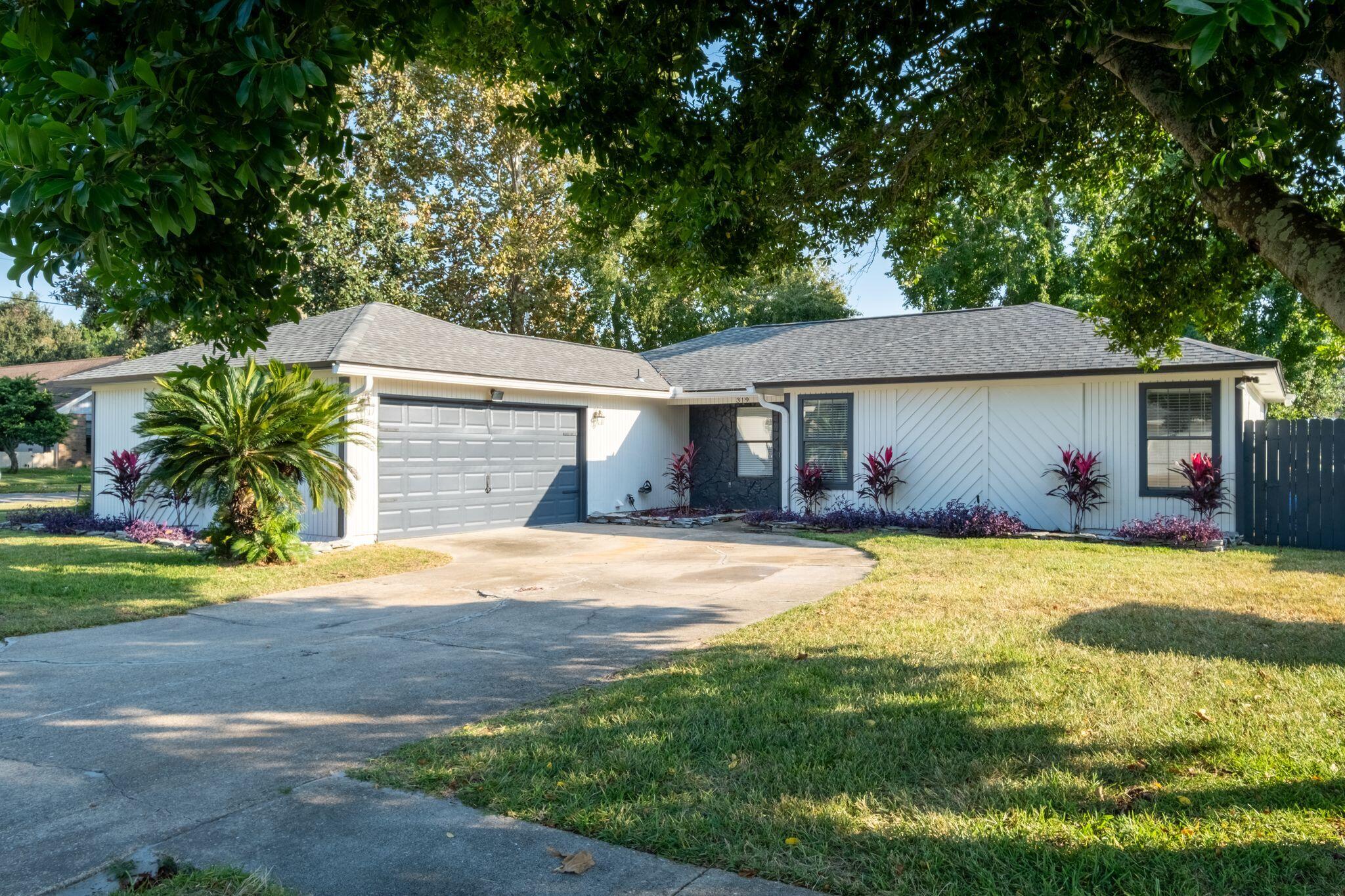 Charming Corner Lot Home at 319 Primrose Place, a beautifully updated 3-bedroom, 2-bathroom home in Destin, just minutes from stunning white-sand beaches and world-class amenities, coastal restaurants & things to do.This home offers an open-concept living area with vaulted living room ceiling with a roof and exterior paint job little over a year old. The spacious master suite includes spa-like en-suite bathroom with dual vanities & skylight. This property is minutes from the local elementary school, less than 2 miles from a boat ramp, and near HarborWalk Village, with no HOA!The privacy fence has parking for jet skies or small boat on property. Put this gem in the heart of the Emerald Coast with a peaceful neighborhood vibe on the list to see. Enjoy outdoor living in the private, low-maintenance backyard, ideal for relaxing or hosting gatherings. 319 Primrose Place conveniently located to Destin's vibrant shopping, dining, and entertainment options, as well  picturesque Destin Harbor. Schedule your private showing and check this one out in person! 
