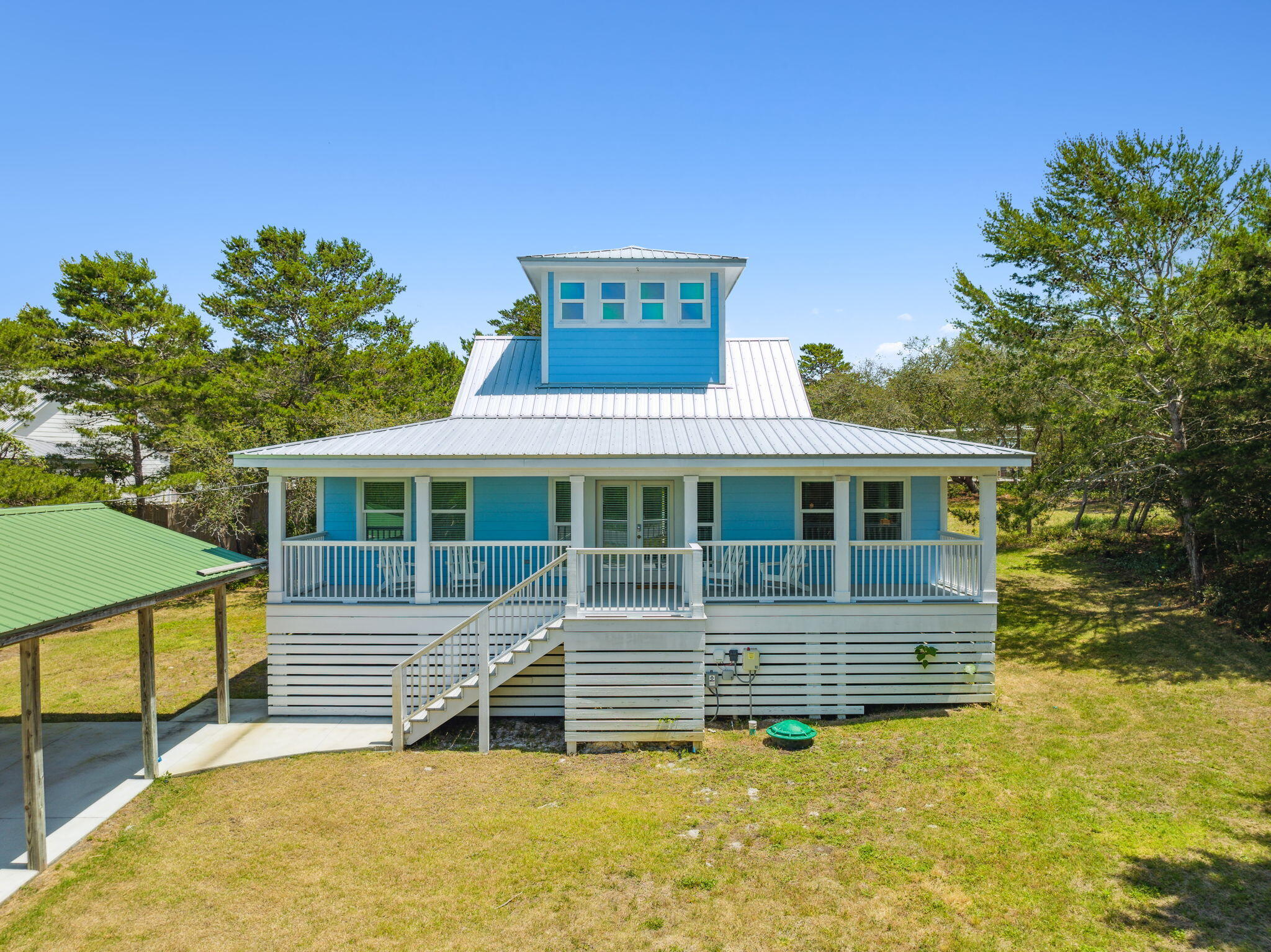 Just a few blocks away to the public beach access of the white sandy beaches of the Gulf of Mexico, this 3 bedroom, 2 bath home with loft sits on 1/2 acre with no HOA. This size lot gives you the option to build onto the home and add a pool. Home was updated in late 2022 and 2023. Fully furnished, all new appliances, bathrooms and fixtures. Never run out of hot water with a gas rinnai. A new well was also in stalled in 2023. Take a bike ride and enjoy all the restaurants along Hwy 30A, recreation and more. Home is rented with Panhandle Getaways and must call for availability to show. Buyer(s) are responsible to personally verify all details for property and dimensions. Any information contained in this listing is believed to be accurate but is not guaranteed.