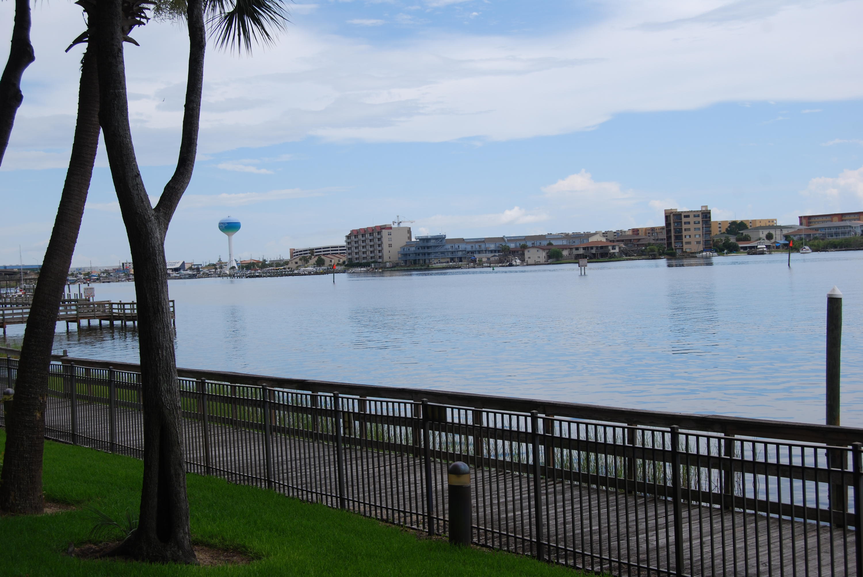 Dreaming of waterfront living? Welcome to the luxurious waterfront gated community of Indianola. This spacious 3 bedroom 3 full bath condo has many upgrades such as 9 ft ceilings, crown molding, granite counter tops, stainless appliances and unit is wired for surround sound. Open, spacious floor plan with large balcony overlooking the park along with water views and entries from both living area and master bedroom. Kitchen sports granite breakfast bar, flat surface electric cook-top and under cabinet lighting. Community in ground pool overlooks the Intercoastal waterway and restrooms are provided. Complex has a private dock with boat slips that may possibly be purchased or leased separately. Property also has a Historic Indian Mound Preservation area located next to pool area which