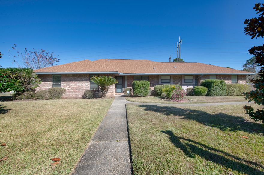 This open concept, contemporary home has it all!  This home was completely renovated in 2015!  Some of the updates include Roof 2015, HWH 2015, ceramic tile flooring throughout, recessed lighting w/ dimmers, quartz counters, soft close drawers, and cabinets.  Outdoor AC unit and duct work replace in 2021.  The kitchen offers an abundance of counter and cabinets space, the island offers more of both and includes a breakfast bar.  The kitchen also has a tiled backsplash and brand-new refrigerator.  The living room has vaulted ceilings, remote-controlled gas fireplace with tile front and glass mantle.  Off the side of the living room is an office area complete with custom cabinets and built-in quartz desk.  There is a half bath located just off the living area. There are two hurricane rated sliding glass doors with built-in blinds off the living room that lead out to the backyard oasis. The backyard is beautifully landscaped!  Enjoy warm days in the pool or cool evenings soaking in the spa. Concrete pad in the backyard behind the double gate is perfect for storing your RV or boat!  Master bedroom is spacious with sliding glass door (also w/ built-in blinds) that lead out to the sparkling pool.  The beautiful master bath features a dual sink quartz vanity, two walk-in closets, linen closet and water closet. The shower has glass shower door with tile surround, built-ins, grab bars, bench and dual showers heads. The laundry room has upper and lower cabinets and a quartz counter perfect for folding or ironing laundry.  The home comes with the washer and gas dryer. There are two additional bedrooms and a fully updated bathroom that bath complete this home. Pool liner was replaced 2019, pool pump 2015, spa pump 2015.  Concrete pad in the backyard behind the double gate is perfect for storing your RV or boat!  