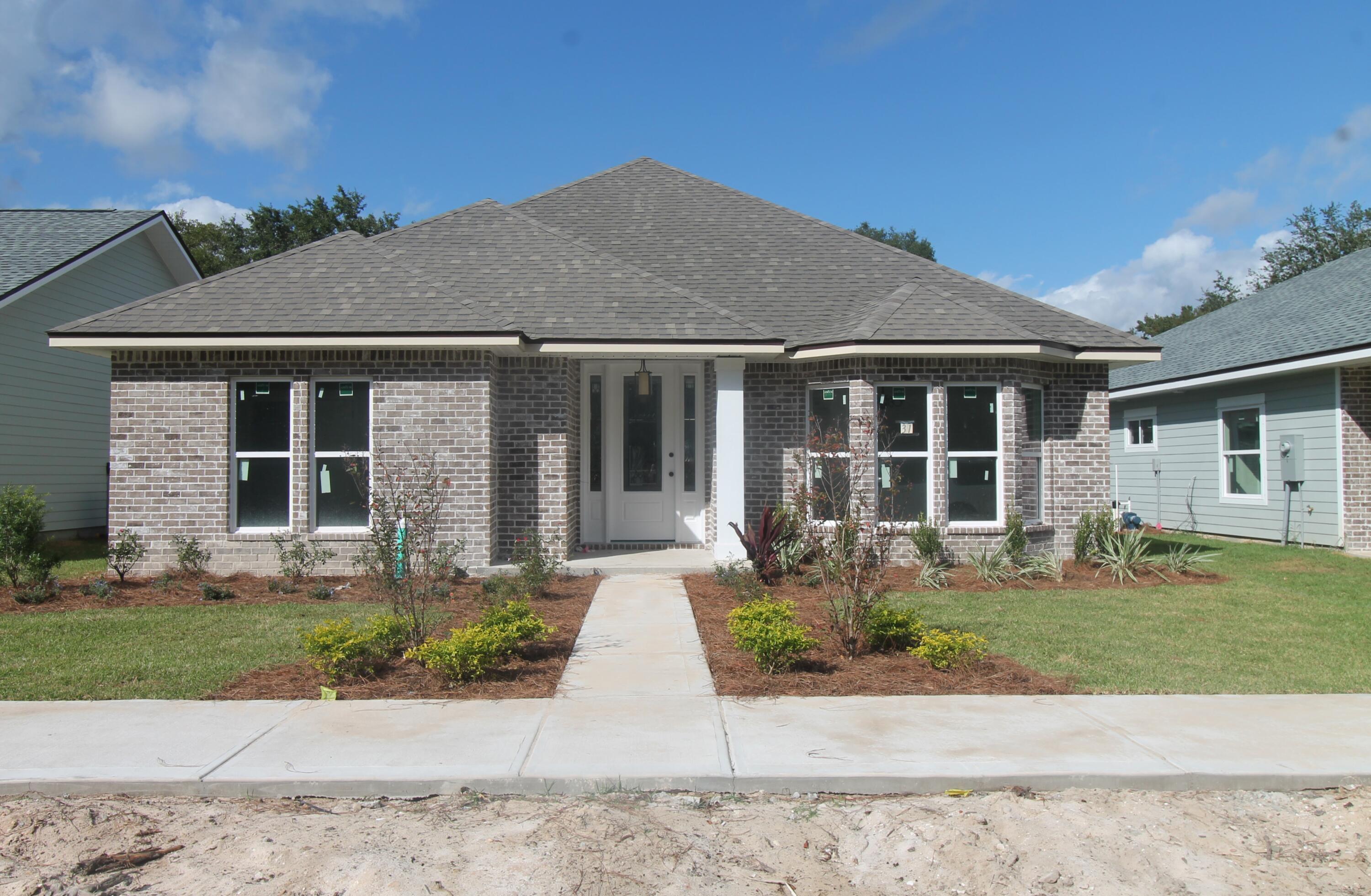 Introducing ''Temple Park at Port Dixie'', a 40 lot development is Shalimar with both underground utilities and broad sidewalks. . This 4BR/3BA, 2CG homesite has 10 Ft. ceilings w/ impressive crown molding, LVP flooring throughout most of the home, tile in the bathrooms, and 5 1/4'' baseboard throughout. Kitchen boasts custom painted Bisque cabinetry, granite countertops, a large pantry, and stainless appliances. Master suite is in the left rear of the home, is very roomy, has 2 large walk - in closets, 2 large walk - in closets, a marble walk - in shower with glass enclosure and a whirlpool garden tub,