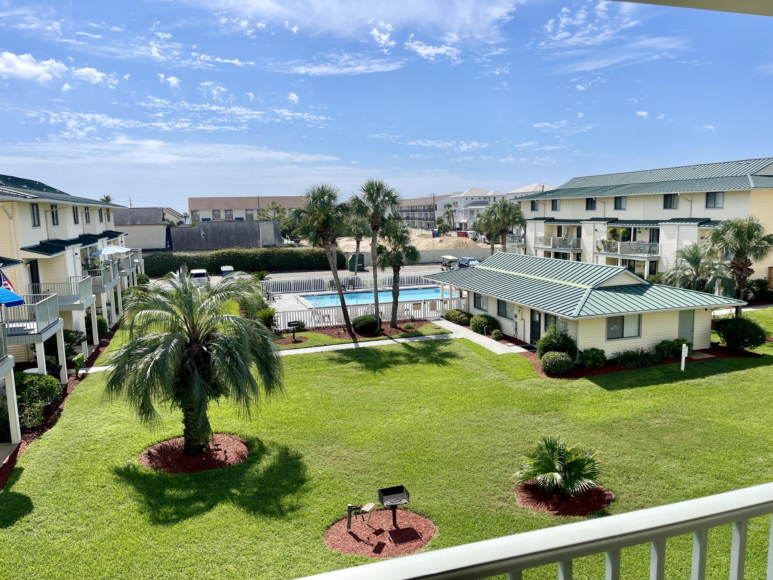 PROFESSIONAL PHOTOS COMING SOON - The only end unit currently available means you not only have just one side neighbor, but you also have superior patio spaces! You will have your own private patio by the kitchen and will also have an additional patio off the 2nd bedroom to go along with all of the extra natural light!This lovingly maintained 2 bedroom 2.5 bath condo has so much to offer. Being offered fully furnished and turnkey, the unit has a half bath on the first floor as well as 3 storage closets, one of which is right as you walk into the unit so you can easily store your beach goods without trekking sand throughout the home. Not that sand would be hard to clean up since the entire unit features luxury vinyl plank flooring throughout. Walking into the unit you will see the open living space that leads into the kitchen with breakfast bar and quartz counter tops. In the kitchen is your first owner's closet. The quaint dining area includes a generous pantry or closet and opens up to the patio overlooking the courtyard and with pool views.
Onto the second floor, you have a split bedroom plane with the laundry closet in the middle as well as another owner's closet at the top of the stairs. Each bedroom has its own private bath, balcony, and two closets. The bedroom on the north side of the unit is where your additional balcony can be found. Since this is an end unit, the bedroom boasts a covered balcony with plenty of natural light. The ensuite bathroom features a larger vanity with sitting area and walk-in shower. The bedroom on the south side of the unit also features a covered balcony, with lovely views of the community pool. The ensuite bathroom includes a shower/tub combo as well as quartz counter tops which can be found in all of the bathrooms.
Parking at Sandprints is easy with having an assigned parking space in front of your unit and overflow parking can be found throughout the complex. The community also offers a beautifully maintained pool and a spacious club house that can be used for special events. Sandprints is in a prime location being only two blocks from Pompano Joe's and the public beach access. Easily ride your bikes to the beach, or down Scenic Highway 98 to get to restaurants, shopping, and more. Being in the heart of Miramar Beach affords you easy access to so much in such a short distance like Silver Shells Outlet Mall, Surf Hut Restaurant, WinnDixie, and much more.