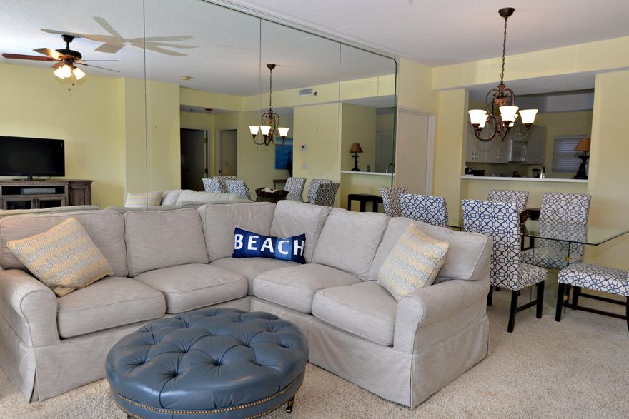 CASUAL COASTAL ELEGANCE defines this well-priced spacious three bedroom, three bath lock-out unit located in the sought after beachside community of Tops'l Beach & Racquet Resort. This condo had a very recent facelift with great results! The end product makes this one so comfortable & pretty that you may not want to ever leave! The floor plan makes the unit very functional as it can easily be used as a permanent home, two separate rental units, or a vacation home for you & your family. There are two separate balconies both overlooking a lovely wooded area encouraging relaxation & total enjoyment of the coastal lifestyle. The beach is just a short stroll away & the pool & hot tub are down the elevator & out the door! Seller is offering a home warranty to buyers for that added