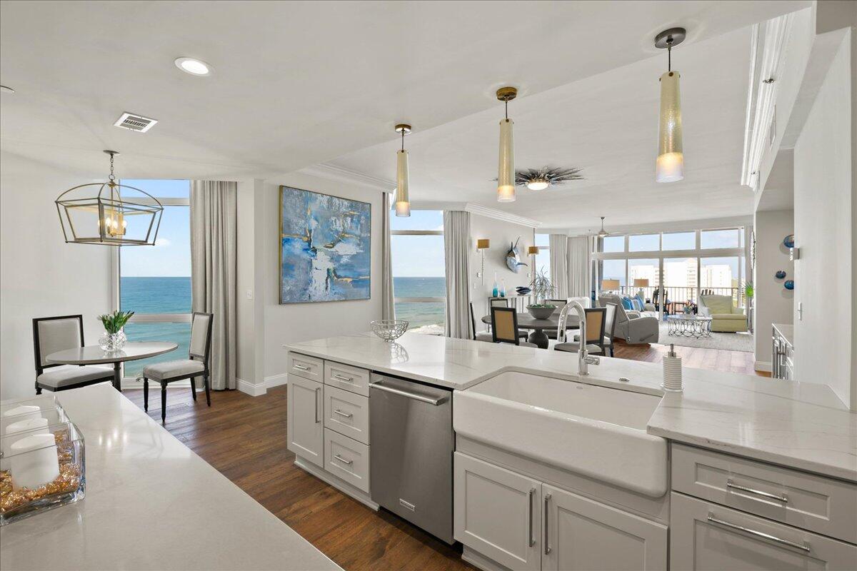 When it comes to ultra luxe Gulf front living, the allure and stature of Regency Towers remains unrivaled. Sprawling half of the ninth floor, this three-bedroom residence is the epitome of private coastal living. The recent remodel curated by the renowned designer Jill Doughty encompasses an open concept, clean lines, and a sophisticated yet minimalistic flair. Upon initial entry, the grand vestibule leads the way to the foyer showcasing 10' ceilings, aged Oak hardwood flooring, and countless premium finishes that are carried throughout.