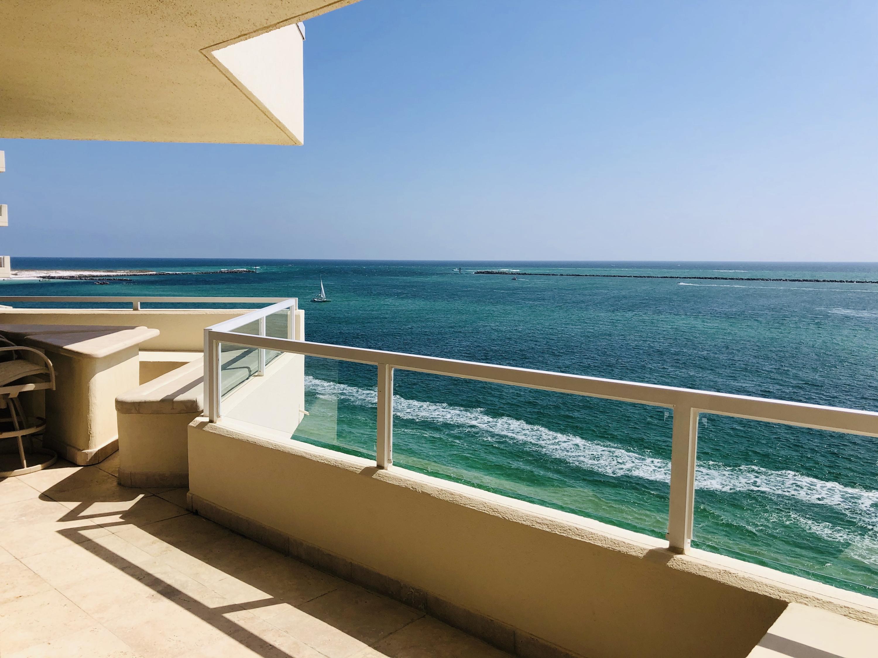 Top Floor Penthouse of East Pass Towers. Breathtaking views of the Gulf of Mexico in every room . View of the Destin Bridge and Crab Island from 600 sqft of balconies. This is a Martinique floor plan 2100sqft, 3 bedrooms, 2.5 bathrooms. Stone surrounds walls, countertops and floors. And Two open Living areas. This Unit is perfect for full time residents or vacation rentals. See Agent Remarks for showing instructions.
