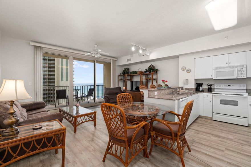 Come live where people dream of vacationing! Bright and welcoming - this condo in the luxurious Shores of Panama is rental ready. This ''A'' unit has an open floor plan kitchen/dining/living room with one bedroom, a bunk room & 2 full bathrooms. With laminate floors throughout the unit, the kitchen features stone counters, white cabinets & appliances, in-unit stackable washer & dryer, coastal decor & stunning views of the emerald coast & lagoon-style pool from the living room and balcony! The unit comes with a dedicated parking spot. Shores of Panama is a 23 story Tuscany style condo of Gulf front luxury accommodations with unparalleled amenities such as 500' Gulf frontage, heated indoor pool, hot tub, sauna and 24 hour security. Schedule a showing today to see your new condo!