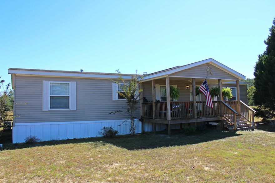 Sportsman's Paradise! Live, Hunt, Fish, & Shoot in your own backyard! This property has it all: 20 acres, 2 creeks, pond, 100 yard shooting range, barn, cross fencing, fenced back yard, RV hook-up with RV parking & a spacious 2008 3-bed 2 bath manufactured home in immaculate condition! A formal entryway awaits you as you enter the home leading to a spacious living room with fireplace, dining room with a bar & kitchen with plenty of storage. The large master suite that is more like an oasis with a garden tub, stand up shower, double vanity & connected his & her walk in closets. The other side has 2 bed & 1 bath & a laundry room leading to the back deck! The 2-story barn has great potential with some TLC. Come see this amazing piece of paradise!