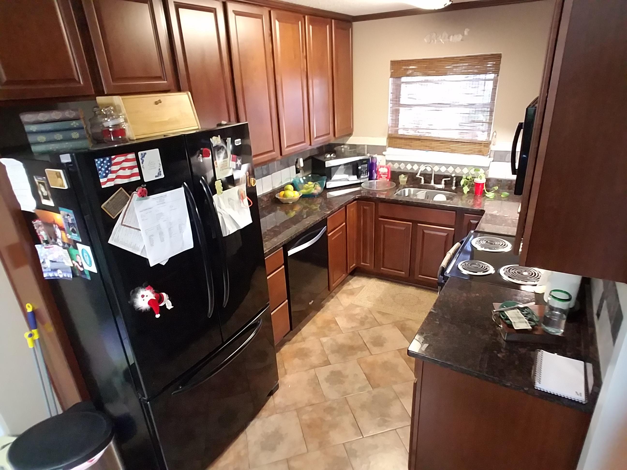 Centrally located, large lot, and 4 bedrooms! What more could you ask for?Just shy of 1900 sq ft this home has everything you need for a family. The kitchen is completely updated as of 2012 with granite counter tops, black appliances, and dark cabinets. Roof and A.C. were installed in 2005! The hot water tank is only 3 years old! The home is CARPET FREE! It has a large living room and dining room combo that leads to the nice and relaxing sun room. The sun room would be perfect for your second living area,toy room, or better yet MAN CAVE! Did we mention it's directly across from the new rec center with tons of activities for the kids! The yard is a great size with a shed that would make the perfect workshop or storage for all of your outdoor activities. Come make this your forever home!