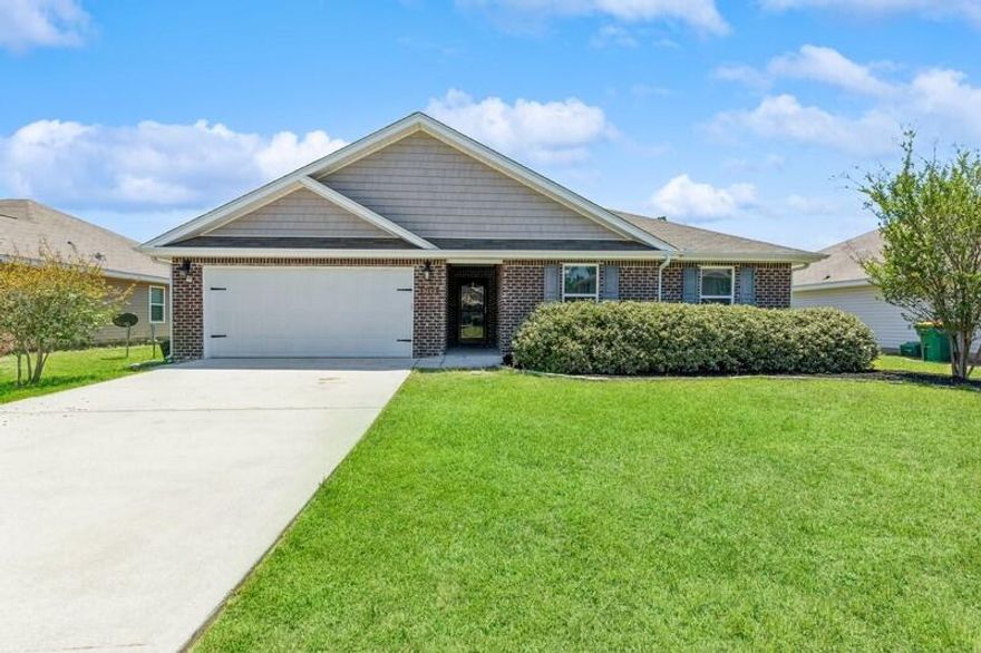 Excellent location! Welcome home to this 4 bedroom, 2 bath home in South Crestview. This home features an open living/dining/kitchen area that looks out over the privacy fenced back yard. The split bedroom floor plan has the spacious master suite just off of the living room, the master bathroom has a double vanity, large separate shower, and soaker tub- PLUS an oversized closet for all of your storage needs! Two additional bedrooms up front and the 3rd is tucked away for added privacy. Updates include: Smart thermostat, USB outlets, recessed lights, stacked stone island, light dimmers, fresh paint, custom entry storage bench and laundry room storage, sprinkler system, gutters, back deck, custom doggie door into dog pen and more! Carpets to be replaced 5/23. Grass in photos is edited.