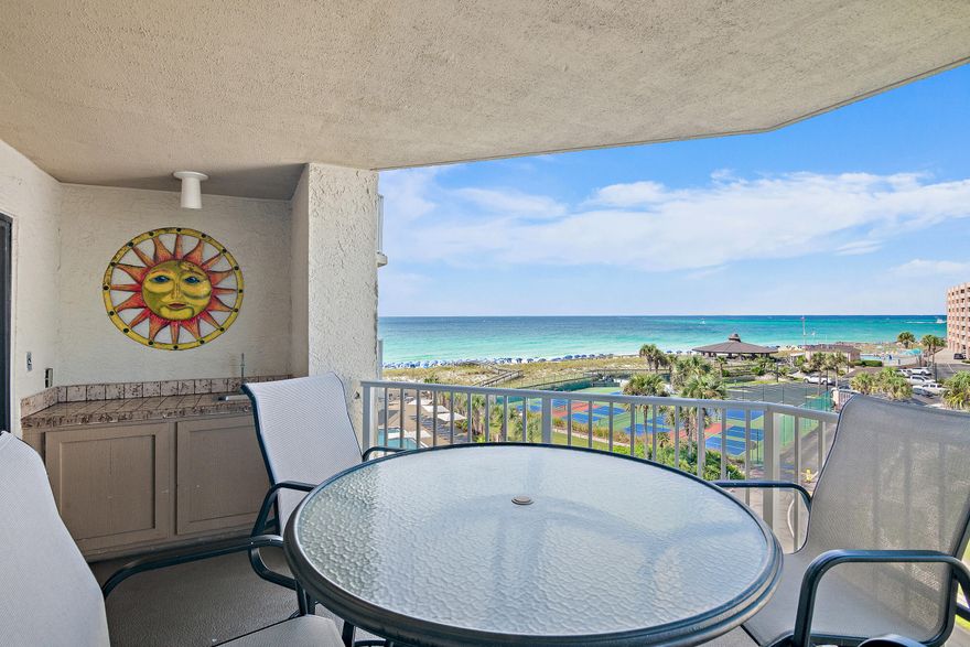 A must see for this tastefully decorated rental ready unit. Fully furnished 2/2 offers 1362 sq. ft. w/new coastal furniture, lvp and tile flooring throughout.  Great gulf views from a private covered balcony to watch spectacular sunsets or enjoy sunrise with your favorite  cup of brew. For peace & tranquility this is the place.  Parking under tennis courts & parking under the building with a large storage unit for beach gear. Owner Pets allowed. 2 doggie stations, lighted pickleball & tennis courts, spa, cabana, shuffleboard, large pool and grills. You can't beat the sparkling sugar white sand & the emerald waters that make you never want to leave.   Assessment in place to be paid by the SELLER. Updates include painting the building, new roof, general updates. Will be Gorgeous!