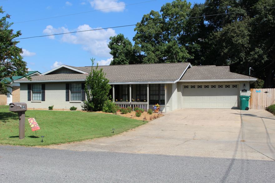 Remarkable and affordable all wrapped up in this wonderful five bedroom home with three full bathrooms. As you approach this home you are greeted by a nice lawn, flower beds, and a covered front porch. As you enter through the foyer, take a small step into the living room accented by a custom-built entertainment center and fireplace. To your right is the formal dining room which leads to the updated kitchen boasting plenty of granite counter top space and ceiling high wood cabinets with custom pantry. French doors open to a Master Suite with vaulted ceiling, featuring his and her closets. Master bath has custom glass and tile shower, two vanities, and a skylight. On the opposite side of the living room is a bedroom that can be utilized as a play room or office.