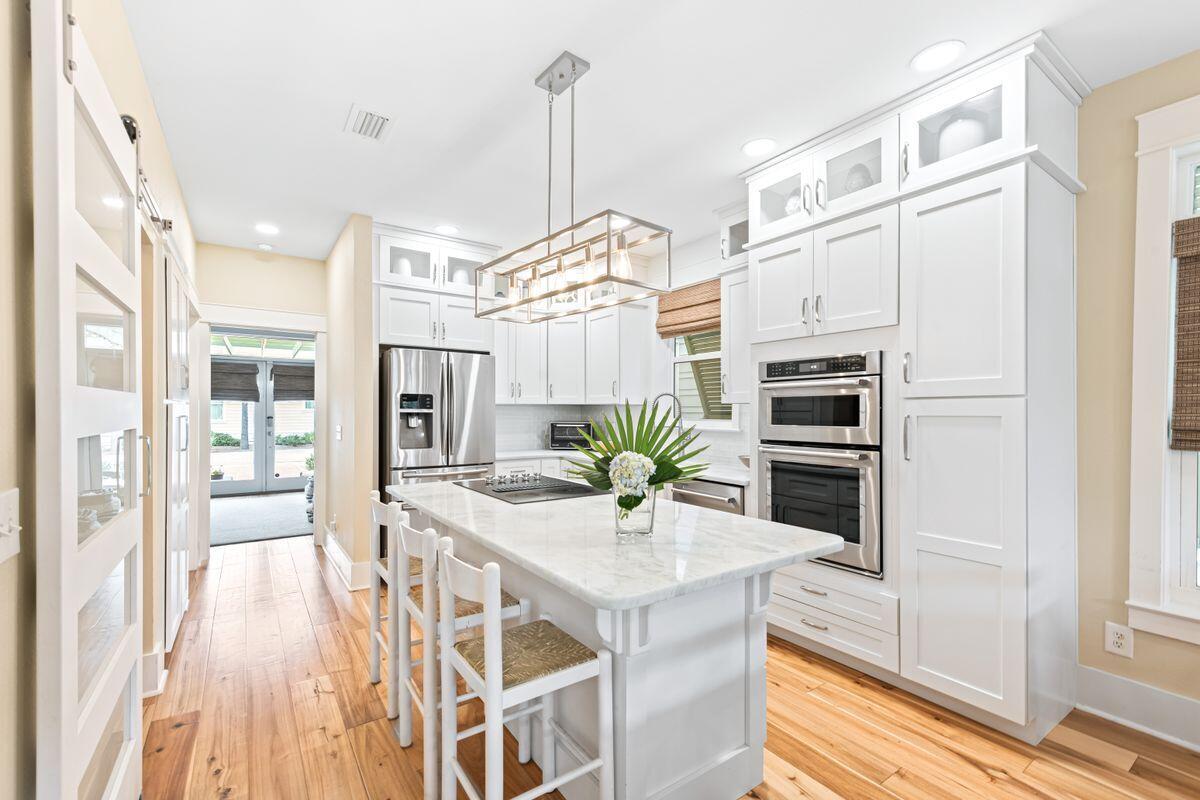 This beautifully maintained beach home features scenic gulf views from the third floor and is ideally located within walking distance of popular 30A beach communities and the Seacrest Beach amenities. Every whim is catered for in this spacious five-bedroom, fully furnished, vacation home, which includes two family rooms and two master suites - both with a private deck. Open main living areas feature beautiful hardwood flooring, and the kitchen offers granite countertops, stainless steel appliances, and a large island. Additional space includes a lower level bathroom and master bedroom. On the first floor you will find an additional cozy living space with a custom convertible queen bed and full bathroom for the extra family or friends.