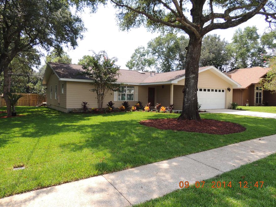 WOW! Beautiful three bedroom two bath home with a lovely open floor plan in an excellent location. This home has it all. The kitchen features all new dark cabinets with new granite countertops, and stainless steel appliances. Both bathrooms have new cabinets and granite vanity tops. The tiled living area is huge with cathedral ceilings, sky light and a new gas fireplace. All three bedrooms have new carpet and the entire interior is freshly painted giving the home a modern look with neutral colors that will enhance your personal decorating choices.