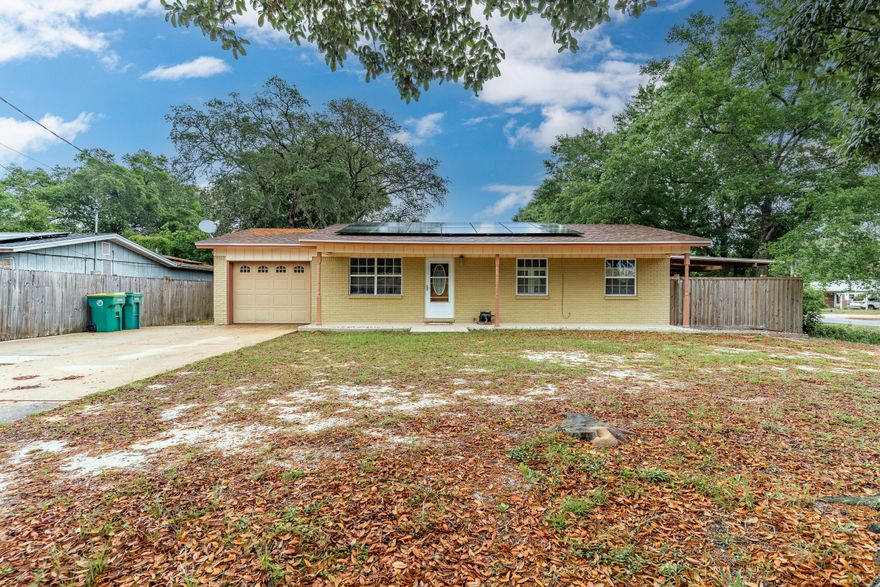 Situated in the desirable Port Dixie community of Shalimar, FL, this charming home is nestled on a corner lot surrounded by majestic Oak Trees. The sunny floor plan offers ample storage space and boasts easy-to-maintain wood and tile flooring. With fresh paint and meticulous upkeep, this hidden gem is move-in ready. Relax on the covered back porch and revel in the privacy provided by the new fence. The expansive yard is perfect for entertaining or pursuing hobbies, with room for an RV complete with an electrical hook up. This delightful home offers a perfect combination of comfort and convenience.