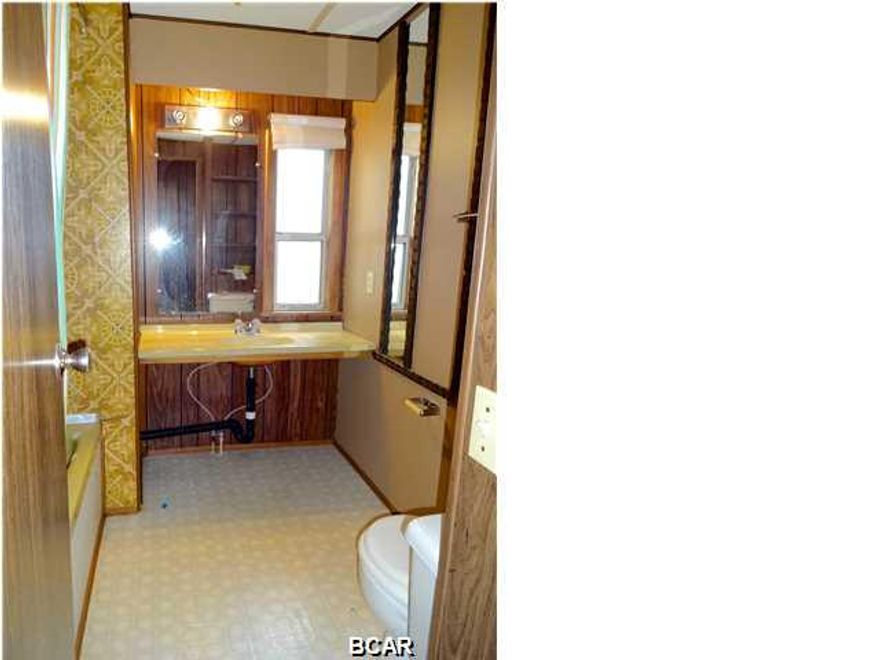 Great location! Only 2 blocks to Laguna Beach! Gulf view from mail box. Mobile home needs TLC. Fix it up until you build your dream home!