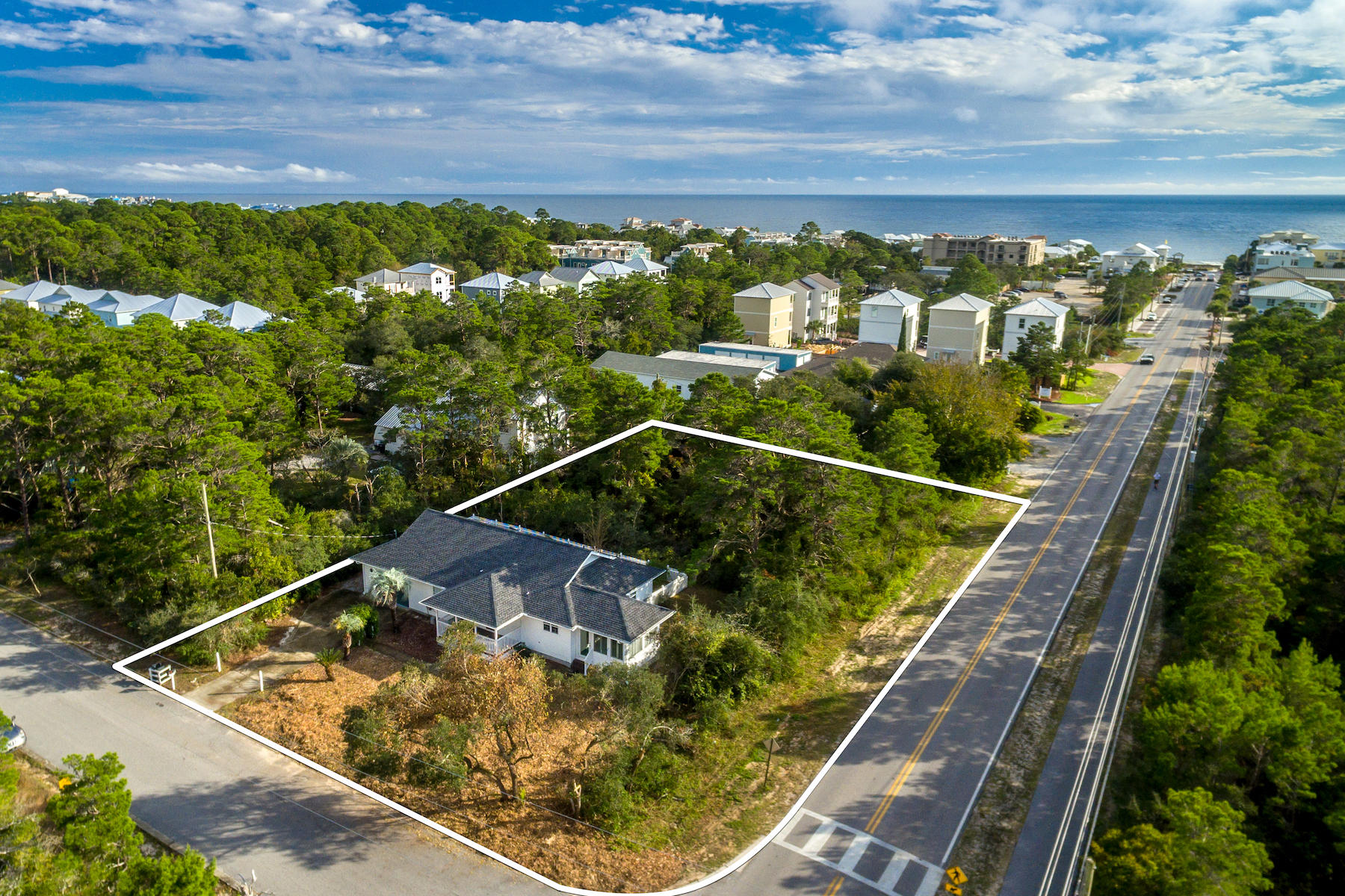 PRICE REDUCED ~ TWO ADJACENT PARCELS ZONED VILLAGE MIXED-USE! Cottage and two lots in a fantastic South Walton location just north of Highway 30A, Gulf Place, and Ed Walline State Park! The home includes a sunroom off the kitchen, a 1+ car garage, and large patio with fenced yard for pets. The home faces Louva Lane, but its side yard and the contiguous lot to the south are on County Road 393, just a few blocks north of 30A, which gives the property re-development potential. Please reference MLS #812124 for details and photos of the existing structure.