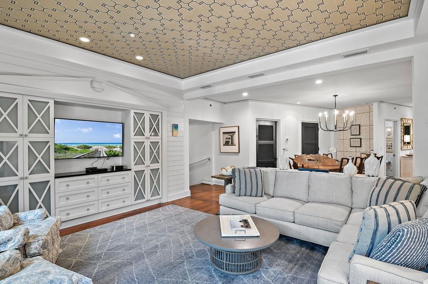 Exquisitely designed and perfectly positioned in the heart of Rosemary Beach, this elegant home is one of the largest of its kind in this master-planned community. Built in 2009, this lovely condominium was completely re-imagined five years later with a major interior makeover that was characterized as forward-thinking with a predominance of timeless elegance. When you step inside this beautifully designed home, you'll understand why. The charm and warmth of the Southern-inspired decor come straight from a palette of coastal influences. Carefully curated beach accents include small shell wallpaper in the powder room, shiplap walls in the sitting room, and an entire wall covered in sheared pebbles in the upscale master bath. Freshly painted walls, new custom lighting and new designer furnishings bring this unique home right up to date and move-in ready. The owner replaced the Air & Heating System in 2022, in 2024 new washer and dryer and Hot water heater. The open-concept floor plan provides a cool and airy ambiance with ample space for entertaining. The corner kitchen is the hub for culinary creativity with a full range of Viking stainless appliances, including a French door refrigerator with pull-out freezer drawers below and Viking gas stove and oven.  A generous pantry, custom cabinetry and under-cabinet lighting take this chef's domain to the next level. Serve fruity cocktails and casual meals at the Carrara marble-topped breakfast bar or in the formal dining room beneath the ambient lighting of the contemporary chandelier. After dinner, move into the living area for social interaction, or put your feet up beneath the decorative ceiling and relax after a busy day. The adjoining balcony is the perfect spot to relax and watch the world go by on the street below. Three large bedrooms include a lavish master suite with a walk-in closet. Master bedroom has two doors that open directly onto the long balcony, allowing you to enjoy fresh sea breezes while reading in the quiet sitting area. The adjoining bathroom is a spa-like haven with its beach-inspired feature wall. The spacious guest suite is equally well-appointed to impress discerning guests. A comfy bunk room with personal TV will delight young visitors. The sought-after Barrett Square address is at the hub of the enviable Rosemary Beach lifestyle. Stroll around the surrounding streets and parks and embrace the relaxed ambiance more commonly found in quaint European towns. Easily stroll down to the beach, passing high-end restaurants and chic boutiques, this home is also conveniently close to the private owners' club, swimming pool, tennis courts, fitness trails and a butterfly garden. Ideal as a vacation home or permanent resident, this outstanding luxury home comes with a stress-free lifestyle that's hard to put a value on.