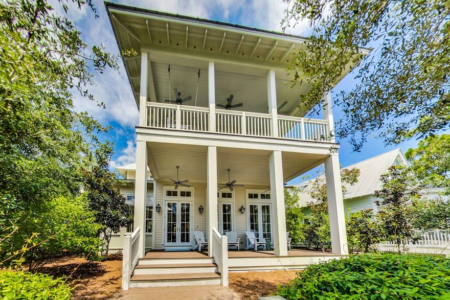 Upon entering the 5 bedroom 4.5 Bath home located in phase 3 Watercolor, you are welcomed by large transom windows allowing tons of natural light, which is amplified by shiplap walls and bright white interiors. The open floor plan flows with a large living area, dining area and A chef's kitchen that features marble countertops and premium stainless steel appliances. The first level also offers a beautiful master suite and a private bathroom with large windows, a glass-enclosed shower, and separate tub. The second floor offers A luxurious second-floor master suite with a private bathroom with a glass-enclosed shower, a soaking tub, and a dual-sink vanity. There are 2 additional guest bedrooms, one with an en-ensuite bath. There is also large bunk room equipped with two built-in twin beds.