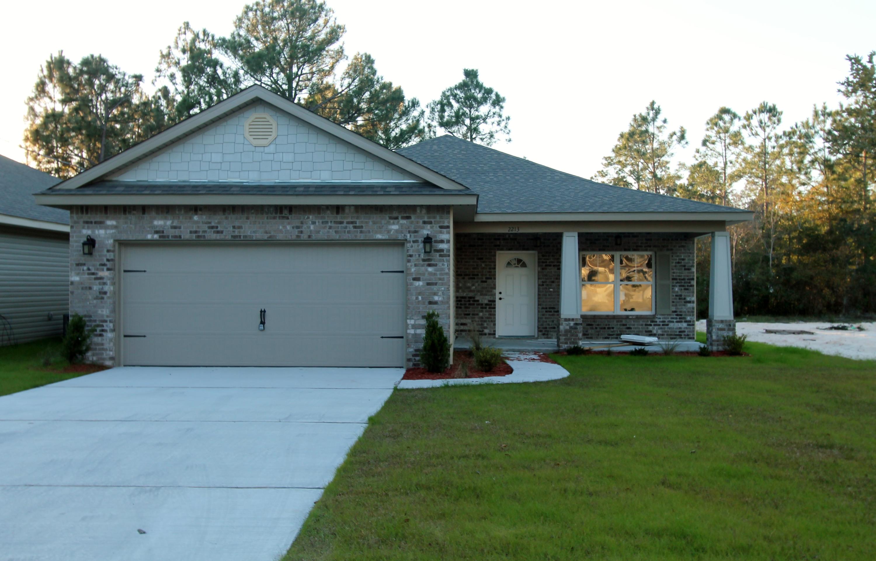New custom 3/2 floor plan with super curb appeal. Great location!!! Tom Street is on the North side of Hwy 98, just 1 minute past the Santa Rosa County line. 10 Ft. ceilings throughout main living areas, as well as tile flooring throughout main/ wet areas. Kitchen opens to the dining room and has custom maple cabinetry, breakfast bar, granite countertops, and stainless appliances. Master suite has a trayed ceiling, 2 walk in closets, double vanity and whirlpool garden tub with separate custom tiled shower. There is a covered porch at the rear of the home, just off the dining room. Completion is expected in late Jan. 2016.