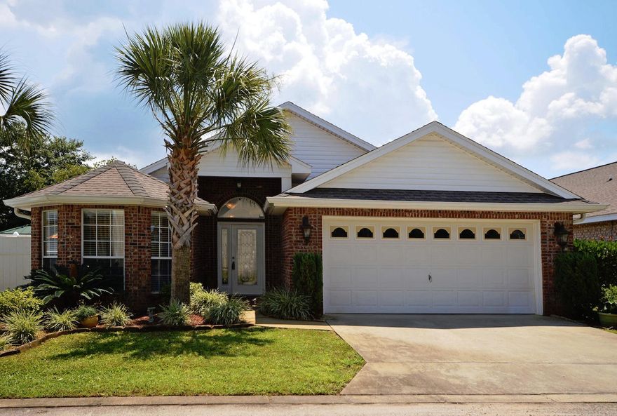 Amazing 2006 All brick 1833 sq. ft. patio home, in the deeded waterfront community of Hidden Bay, with BOAT SLIP AND 10k LB BOAT LIFT INCLUDED. All brick home in waterfront community on East Bay and just across the road from the Hidden Creek golf course. Just minutes to the sugar white sands of Navarre Beach and the Gulf of Mexico. Open floor plan with 14' vaulted ceilings, custom cabinets with granite counters and work island in kitchen. 18'' designer porcelain tile in living areas and upgraded carpet in bedrooms. Gas fireplace with built-in wood bookcases on either side. Upgraded ceiling fans, laundry room with deep tub, whirlpool tub and separate shower in master bath, brushed stainless faucets, huge master walk-in closet with extra shelving, and much more, super efficient floor plan.