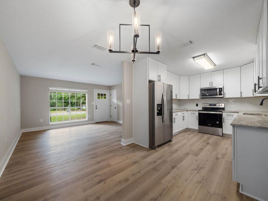 BATHROOM HAS POCKET DOOR ENTRANCE FROM MASTER BEDROOM AND HALLWAY MAKING THE FEEL OF A 2 BATHROOM HOME. VERY COOL!! Seller will pay $7000 in buyer concessions.  Home with large lot and a sweet home that has been completely remodeled with new kitchen cabinets, granite counter tops, flooring, lighting, stainless steel appliances.  The home has all new laminate hardwood flooring in living areas, new ceiling fans and lighting throughout, new bathroom upgrade with tile surround on tub, new cabinet, lighting and mirror.  Bedrooms have new carpeting, ceiling fans and lighting.  New interior and exterior paint, plus new roof and HVAC..  Home has living room and eat-in kitchen, additional room off kitchen for family activities.