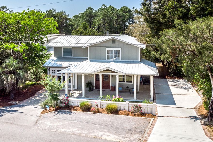 Welcome to 155 Dune Dr, conveniently located just north of 30A's newest Regional Beach Access. Offered furnished! The shaded, well-manicured lot offers a large fenced back yard, & expansive covered patios. Solid, double entry doors with glass panels are aesthetically pleasing while allowing an abundance of natural light, a common theme throughout with transom windows & French doors. Extensively remodeled with quality, timeless features: wood flooring in the main living area & stairs, crown molding, & an attractive barn door. The sunken kitchen with center island features tongue & groove ceilings, board & batten paneling, & custom reclaimed doors covering the pantry & laundry. Driveway & street parking is equipped to accommodate 7 vehicles comfortably, or a boat or RV.