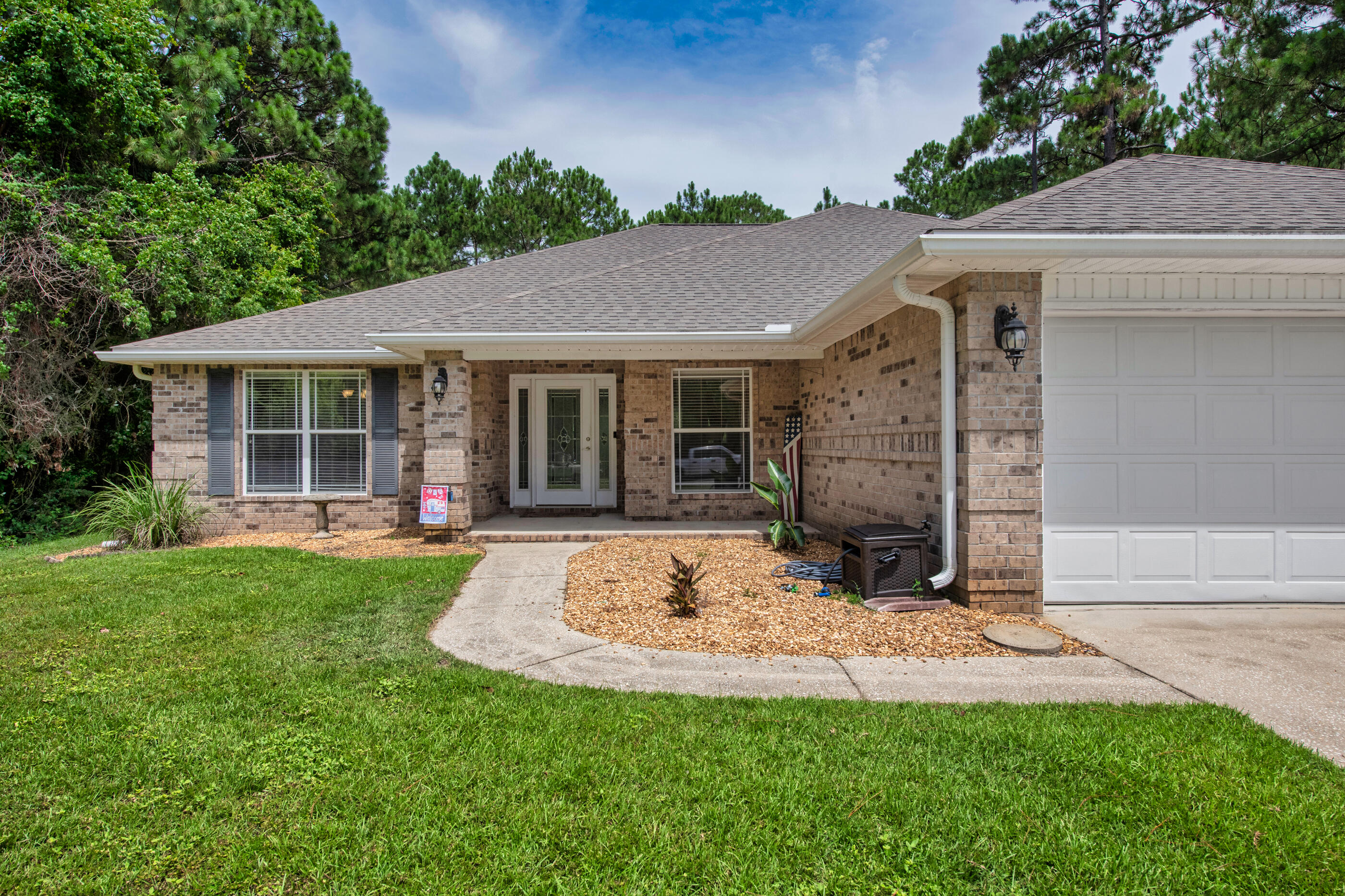 Welcome to Your Florida Dream Home featuring a Pool, Porch & Plenty of Space! Step inside to a bright, open layout with NO carpet and plenty of room for everyone to spread out. This tri-split floorplan features an owner's suite on one side of the house with its own mini split so you can have your room extra cold at night, a guest bedroom with access to a guest bathroom, and then two more bedrooms and a cabana bathroom near the back of the home! The kitchen is perfect for cooking up family meals or entertaining friends with plenty of counter space and cabinets AND a good-sized pantry. Speaking of entertaining, check out the Florida oasis waiting for you in the backyard. This home has an expansive screened-in porch, outdoor kitchen and upgraded Blue Haven gunite pool featuring Rico Rocks, lighting and upgraded decorative tile, plus tropical landscaping and a privacy fence! Do you need more space for your cars, toys, tools, or that gym setup you've been eyeing? Don't miss the 3 car garage or the large shed in the back.
Oh, and did I mention it's in Holley by the Sea? That means access to an awesome recreation center, gym, tennis courts, pool, and more. But don't worry Everglades is only 2 minutes to the Coral/98 stop light! You'll be near all your favorite things: less than 25 mins to Hurlburt, 5 mins to Walmart Neighborhood Market and 10 mins to Navarre Beach!