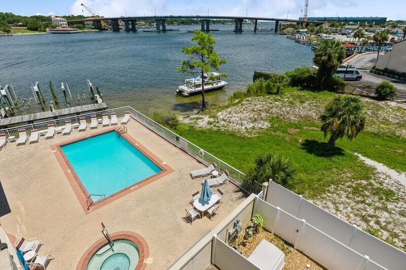 CURRENTLY UNDER CONTRACT--SHOWING FOR BACK-UP OFFERS! THIS GEM HAS BEEN RENOVATED WITH NAUTICAL TOUCHES & COASTAL INFLUENCES! SOOTHING BLUES & GREENS ENHANCE A CLEAN, WHITE PALETTE! ADORABLE SOUNDSIDE UNIT IS CURRENTLY BEING USED AS A SHORT-TERM RENTAL IN THE HEART OF OKALOOSA ISLAND! QUARTZ COUNTERTOPS, CEILING FANS, NEW FLOORING, STUNNING TILEWORK, BARN-DOOR FEATURE & BALCONY OVERLOOKING THE EXCITING BOAT LIFE OF SANTA ROSA SOUND! AMENITIES INCLUDE POOL, HOT-TUB, BOARDWALK TO BEACH & GULF & GRILL AREA-GROUND LEVEL! CONVENIENT TO RESTAURANTS, TOURIST ATTRACTIONS, SHOPPING!***ONE PET ALLOWED--OWNERS ONLY***