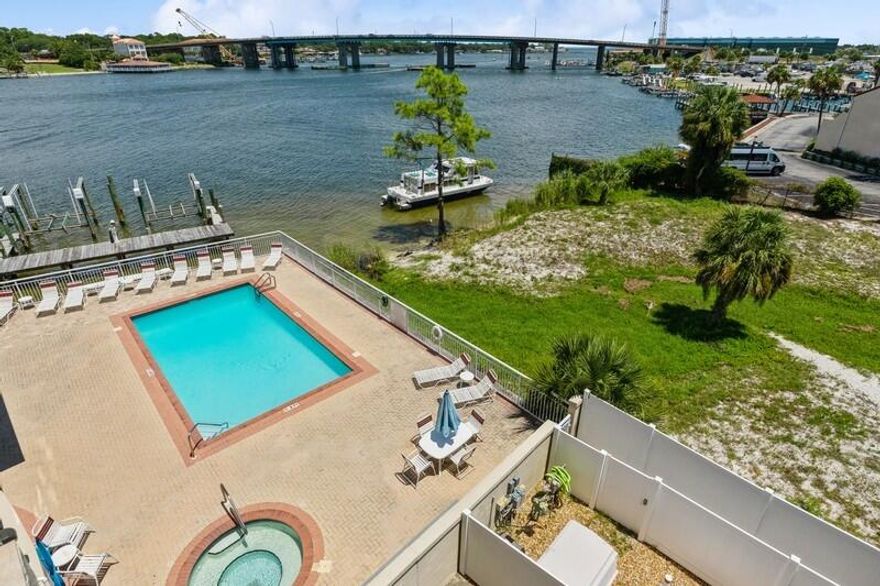 CURRENTLY UNDER CONTRACT--SHOWING FOR BACK-UP OFFERS!  THIS GEM HAS BEEN RENOVATED WITH NAUTICAL TOUCHES & COASTAL INFLUENCES!  SOOTHING BLUES & GREENS ENHANCE A CLEAN, WHITE PALETTE! ADORABLE SOUNDSIDE UNIT IS CURRENTLY BEING USED AS A SHORT-TERM RENTAL IN THE HEART OF OKALOOSA ISLAND! QUARTZ COUNTERTOPS, CEILING FANS, NEW FLOORING, STUNNING TILEWORK, BARN-DOOR FEATURE & BALCONY OVERLOOKING THE EXCITING BOAT LIFE OF SANTA ROSA SOUND!  AMENITIES INCLUDE POOL, HOT-TUB, BOARDWALK TO BEACH & GULF & GRILL AREA-GROUND LEVEL! CONVENIENT TO RESTAURANTS, TOURIST ATTRACTIONS, SHOPPING!***ONE PET ALLOWED--OWNERS ONLY***