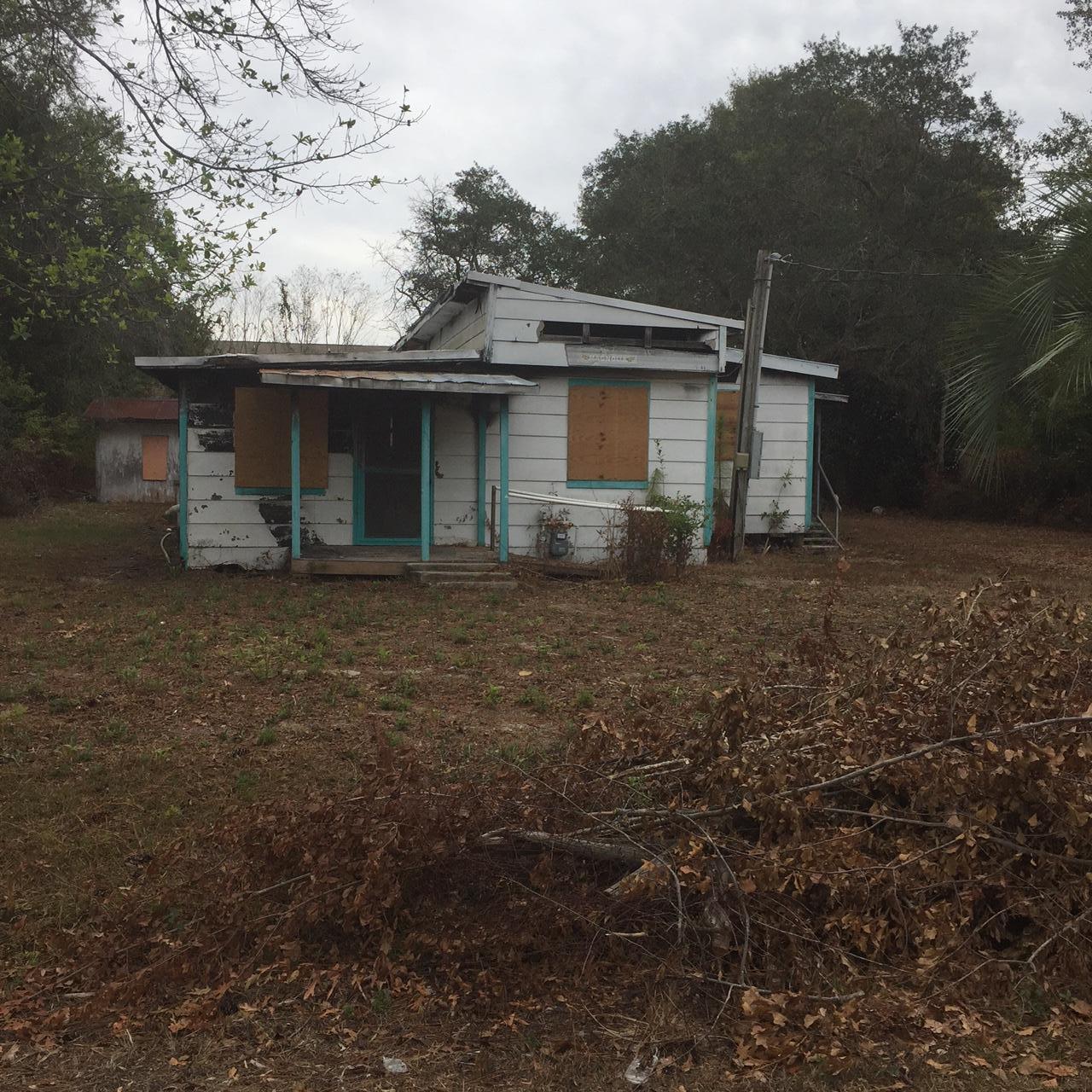 Nice sized parcel located in East Niceville/Bluewater Bay area. Sold AS IS with deserted building, well, and septic tank.