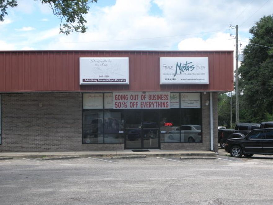 End cap retail unit with approx. 1/2 is showroom, 1 office, 2 large rooms, and 1 restroom, has rollup door on rear side of building. Located 1 block east of Kohl's and Winn-Dixie and a couple of blocks from the hospital.