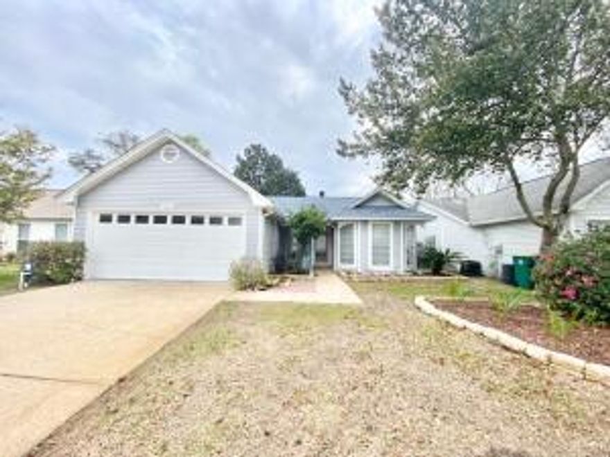 This move-in ready property offers a thoughtful blend of updates and comfort throughout. Inside, the spacious living area includes tile flooring and a wood-burning fireplace, creating a warm and inviting focal point. The split bedroom layout enhances privacy, with a centrally located full bathroom featuring a tub and updated fixtures. The kitchen is equipped with granite countertops, tile flooring, and modern appliances, making it both functional and stylish. The primary suite offers ample natural light and an adjoining bath. Outdoor features include a rear deck ideal for relaxing or entertaining. Roof was replaced in 2022 and the HVAC in 2020.