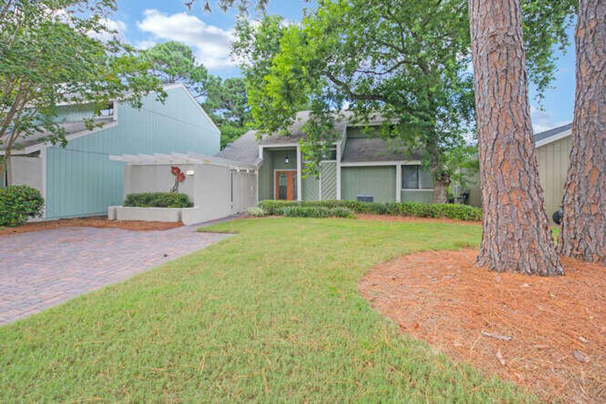Fully furnished home is located in Sandestin's Linkside Village. The open living area features cathedral ceilings, travertine flooring and double French doors lending to Golf Course and Bay views. The kitchen boasts custom cabinetry, granite countertops, stainless steel appliances, breakfast bar and recessed lighting. Off of the kitchen is a dinette with built-in book shelves and access to the outdoor courtyard. The first floor features the two bedrooms. Bedroom one features walk out to covered deck overlooking the Golf Course, also features en suite bath with jacuzzi tub. The bedrooms have wood floors and crown molding. The second floor features the master bedroom and office. The master bedroom has built-in bookshelves and a large balcony with unparalleled panoramic golf course views.