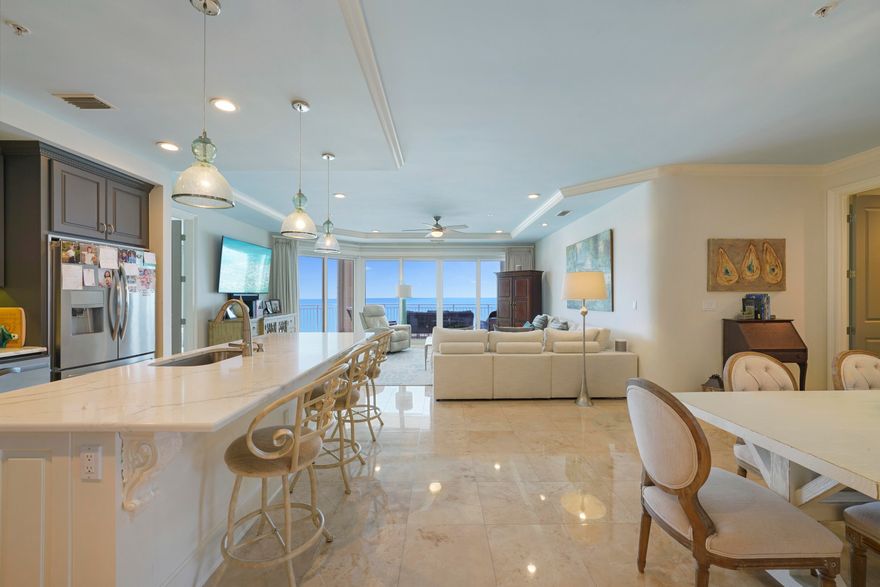 Experience the epitome of luxury in this exclusive, beachfront villa in Miramar Beach, where rentals are restricted. This exquisite 4-bedroom, 4-bathroom residence spans 2,844 sq. ft. and is perched on the 18th floor of Grand Dunes II, offering a coveted 20th-floor elevation with unparalleled Gulf of Mexico views. The highly desirable ''50'' stack floor plan, known for its exceptional layout, is available partially furnished for added convenience. Upon entering, you're greeted by a stunning open-concept living space designed for both comfort and elegance. Floor-to-ceiling windows flood the space with natural light and provide sweeping, panoramic views of the emerald waters. The Villa features a private entry foyer with honed travertine flooring, expansive 9.5' ceilings, and "Super Quiet" interiors. It's pre-wired for the latest security and home entertainment systems and boasts solid wood doors and oversized glass windows framing the Gulf vistas.

The gourmet kitchen is a chef's dream, equipped with high-end stainless steel appliances including a GE 5-burner natural gas cooktop, updated refrigerator, dishwasher, ice maker, and microwave. Custom Quartz countertops, a Quartz bar, and custom-painted cabinetry with soft-close drawers complete the luxurious space.  The Primary Suite is a serene retreat with "His & Hers" walk-in closets, trayed and coffered ceilings, and a sitting area. The en-suite bath features dual Quartz vanities, a separate dual-head shower, a spa-like jetted soaking tub with a travertine surround, and a separate water closet.

Savor your morning coffee while watching the sunrise over the water, or unwind with a glass of wine as the sun sets on the horizon.  Step out onto the expansive 11' deep Gulf-front balcony, offering over 350 sq. ft. of space with a built-in natural gas grill all protected by "Hurricane Shutters."

Grand Dunes offers: "Super Quiet Interiors", 24 hour security, gated entry, lush landscaping, 3 levels of gated underground parking for owners, grand lobby, semi-private elevators leading into your private foyer, private heated pool & hot tub, Owner's Lounge with Gulf front Fitness Room, Overflow suites for guests, 200' of deeded beach, serene streams, majestic waterfall and a Lagoon Style Gulf front pool area with Hot Tub shared by both buildings and Beach Service.

Grand Dunes is the Emerald Coast's Most Desired Rental Restricted Beachfront Development!

Call us today to schedule your private viewing of this gorgeous Villa!
