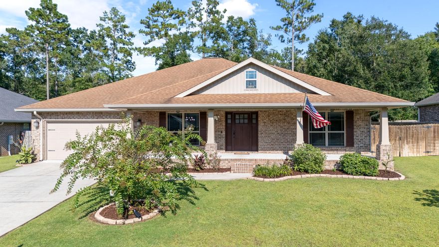 In Zachary Estates, homes rarely come available, a true sign of just how desirable this neighborhood is. Tucked among well-kept streets and picture-perfect lawns, this 2,705 sq ft residence is ready to welcome its next owner with space, character, and thoughtful updates throughout.A long driveway leads to the two-car garage, while the facade is defined by a full-length covered front porch, perfect for a set of rocking chairs to enjoy quiet mornings. Step inside and you'll be greeted by tall ceilings and generous rooms designed for both comfort and function. To the left of the foyer, the dining room impresses with a floor-to-ceiling window that frames views of the front porch and tree-lined street. To the right, a pair of freshly painted bedrooms with new plush-padded carpet are connected by a private Jack-and-Jill bath.

The heart of the home is the open concept living and kitchen area, anchored by soaring 12-foot cathedral ceilings. The kitchen features granite countertops, ample cabinetry, a versatile coffee bar nook, and a center island with sink that creates a natural gathering space. Stainless steel appliances complete the modern appeal. Off this area, two additional bedrooms offer flexibility  one freshly updated, the other with LVP flooring positioned next to a full bath, ideal as a guest or mother-in-law suite.

The primary suite is a true retreat with tray ceilings, a cozy nook perfect for reading or even a nursery corner, and an ensuite bathroom featuring separate vanities with individual counters and sinks, a corner garden tub, and a walk-in shower.

Step outside to find a covered back patio with a natural gas line ready for an outdoor kitchen, an extended concrete pad for entertaining, and a beautifully manicured lawn. A double-gated fence opens to trailer, boat, or RV parking with electric already in place. At the back of the property, a workshop with its own porch adds even more potential whether as a hobby space, storage, or a future pool house.

Set on a quarter-acre lot in one of Crestview's most established neighborhoods, this 5-bedroom, 3-bath home offers the rare chance to live where homes simply don't come on the market often. Offered at $399,900.