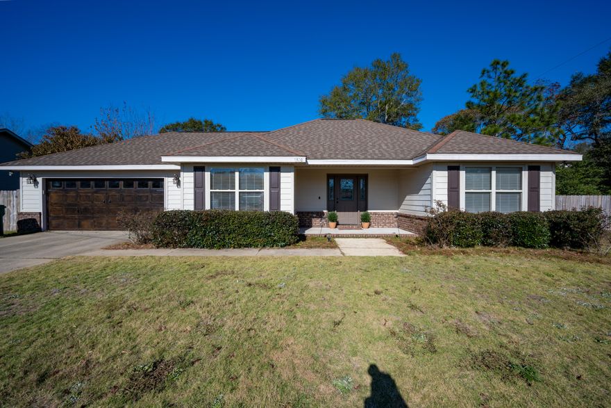 Custom Built 4 bedroom 2 bath home located on .45 acre lot. Home features lots of updated finishings. The exterior of the home consists of dimensional shingles, brick skirting on the front and hardy board on the remainder of the home. The interior showcases attention to detail with the upgraded trim package, tray and coffered ceilings and upgraded cabinetry with beautiful crown molding. The living room features tray ceilings and with shadow lighting. The flooring consists of porcelain tile in all wet areas and frieze carpet in the remainder of the home. The kitchen boasts custom mple cabinetry with under cabinet lighting and solid surface countertops. Call listing agent to schedule an appointment to view this property it won't last long!