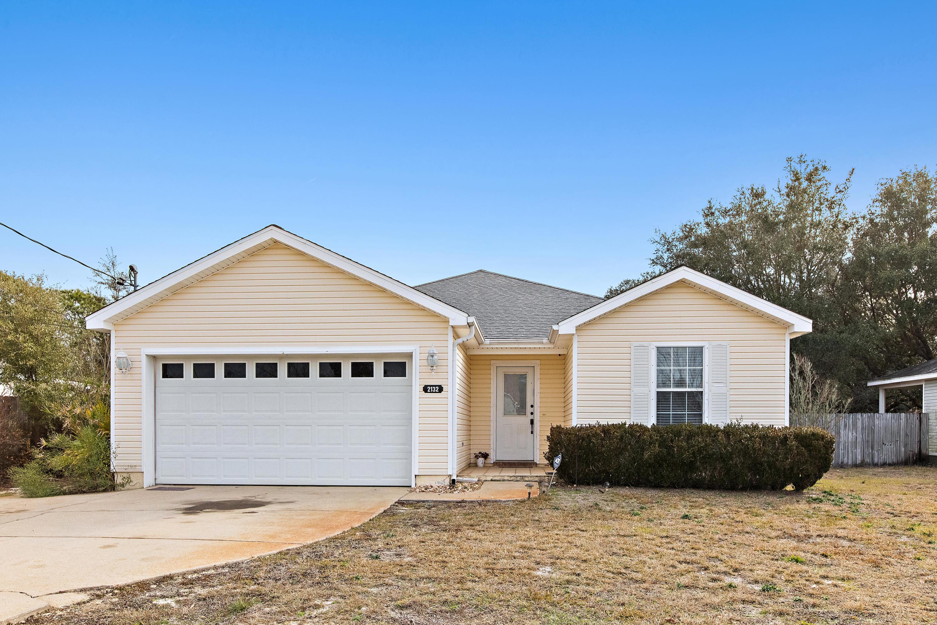Located in the family friendly Vizcaya subdivision, 2132 Las Vegas Trail is a charming, modestly priced home. Conveniently located in the heart of Navarre and within walking distance of highly rated Navarre Primary School, this home also offers ease of access to Highway 98, pristine beaches, shopping, Pensacola, and Hurlburt Field. This home is warm and inviting, surrounded by manicured landscaping and complete with durable siding and ceramic tiled entryway. Once you enter the foyer, you are greeted by the spacious living area that provides high ceilings and an abundance of room for furniture. The dining area is charming and conveniently located next to the kitchen. The kitchen is cozy with large cabinets and pantry, and lovely countertops. Located past the kitchen is a unique laundry