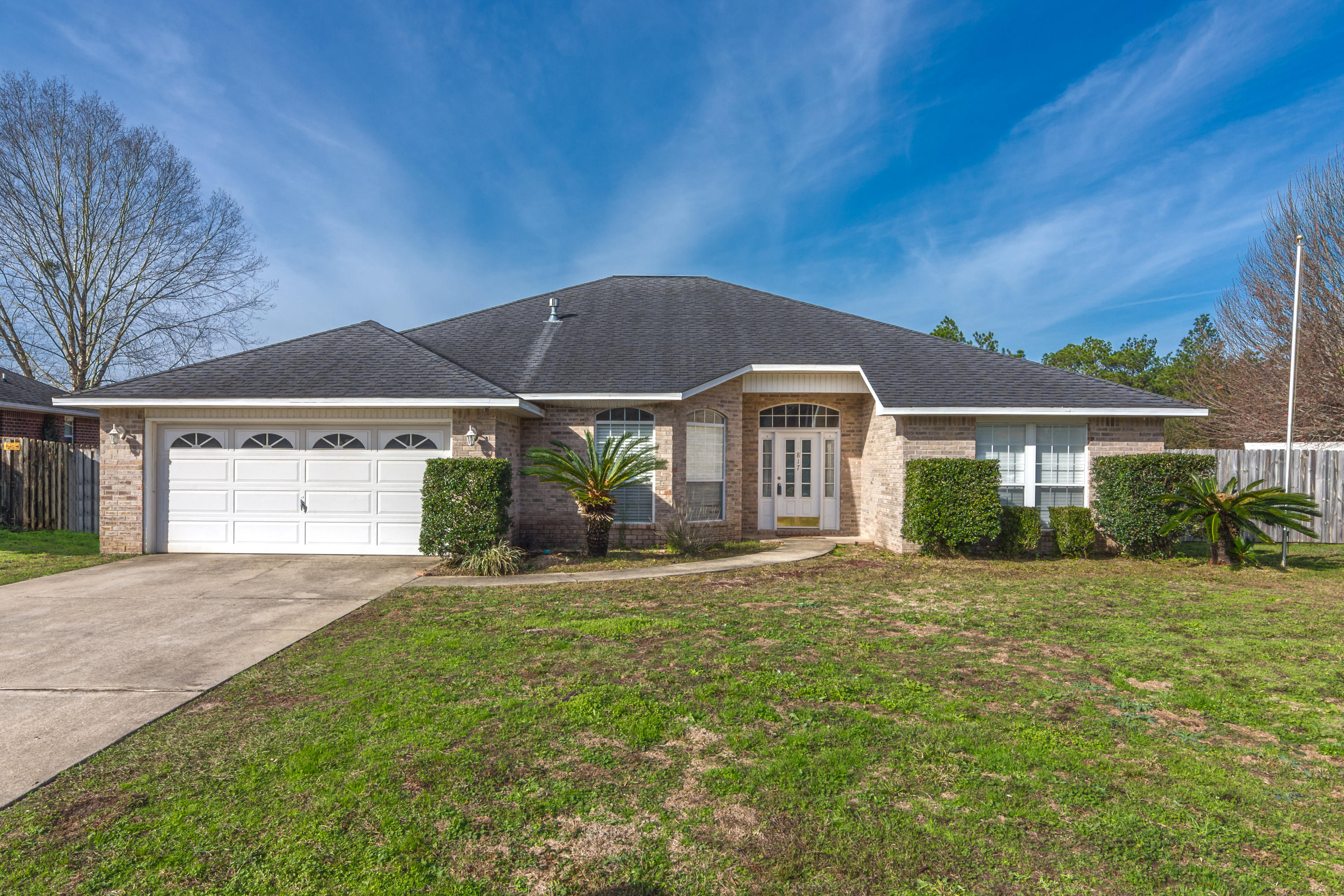 Looking for a Large home in South Crestview? Come check out this beauty. Pull up to this all Brick home, park in the FLAT driveway at the cul-de-sac end of a quiet street. Sidelight front door and Extra high ceilings greet you. 4 spacious bedrooms, featuring carpet and ceiling fans. The master is HUGE and master bath is complete with a romantic tub, separate shower, dual separate vanities, tiled floors, and a ginormous walk-in closet. The heart of the home kitchen brings a chef's dream with gas stove, deep sink, loads of counter and cabinet space, and a 5 foot pantry! The kitchen opens to a bonus breakfast nook, or take your coffee out in the serene screened porch overlooking green space, with a view to boot! 2 car garage, and seated on over 1/3 fenced acre with privacy abounding.