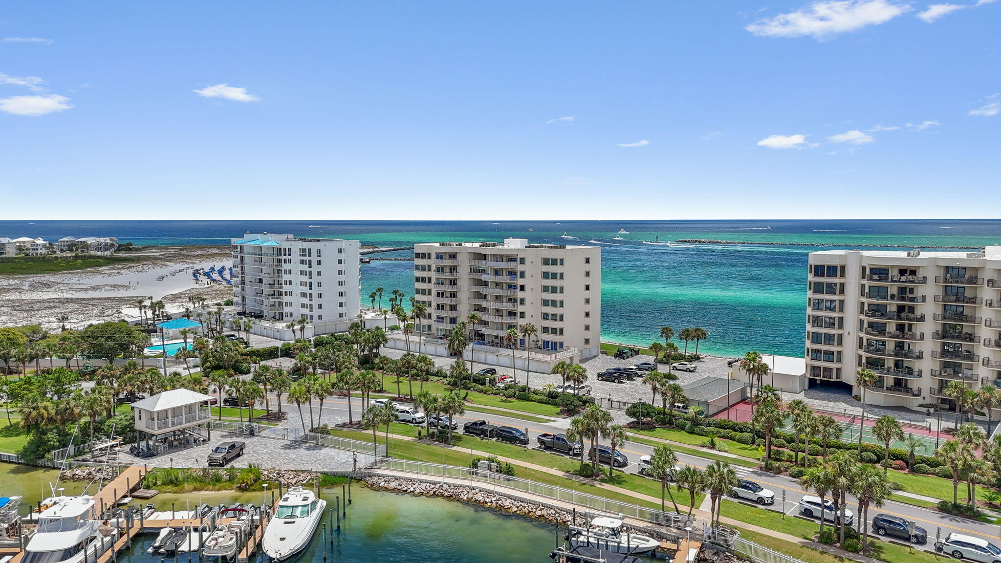 Welcome to Waterview Towers in Destin! This beautifully appointed 3-bed, 3-bath condo offers the perfect blend of luxury and comfort, ideal for your family vacation. Step into a grand eat-in kitchen, featuring stainless steel appliances and ample counter space. The spacious living area with hardwood floors throughout provides a warm and inviting atmosphere for gatherings or quiet evenings in. Retreat to the gorgeous primary suite, complete with a lavish soaking tub in the en-suite bathroom, where you can unwind and take in the views. Each of the additional bedrooms offers generous space and comfort with bunkbeds and another queen. This well-maintained building boasts fantastic amenities, including a social room, gym and jetski lift.