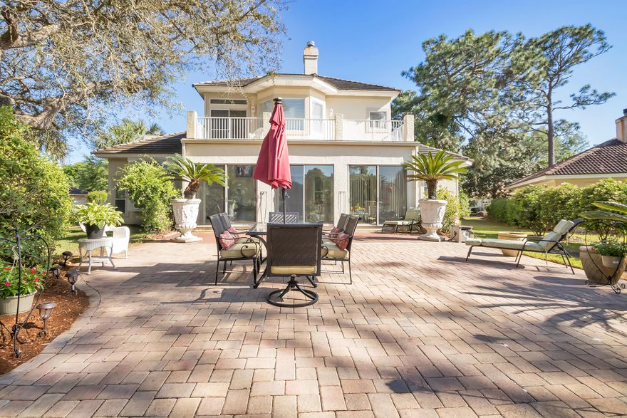 Absolutely stunning home located on a gorgeously landscaped HUGE corner lot, on the Shalimar Pointe Golf Course! This home is in one of the finest gated communities in our area and in fantastic condition! HARDWOOD FLOORS, vaulted ceilings, built-in book cases a gorgeous gas burning FIREPLACE. You will absolutely love the kitchen which features REAL WOOD cabinetry, granite counters, stainless steel refrigerator, tile floors, a kitchen sink that overlooks the rear garden and take a moment to enjoy breakfast in the we lit kitchen nook. Off the kitchen don't miss the HUGE (38 x 16) Florida room which exits to the over sized backyard paver patio. The Florida room is a wonderful space which can be used as a workout room, play room, or sitting area. The MASTER BEDROOM is DOWNSTAIRS and has a wood burning fireplace, ample space in the closet for his/her clothing and sliding glass doors which exit to the Florida room. The master bath has been COMPLETELY REMODELED with a soaking tub, separate and over sized tiled shower, neutral tile floors and dual sink vanity. Upstairs you will find 2 large bedrooms each with their own private RENOVATED BATHROOMS. One bathroom has a tub with tile shower surround, new toilet, new vanity and new tile flooring. The other bathroom has a standing tile shower, new vanity, new toilet and new wood-like tile flooring.

This home has a tiled roof, hurricane shutters, 2 car side entry garage with a separate 3rd rear entry GOLF CART entrance. You would be remiss not to come take a look at this beauty - it is one of the finest homes in the area.
. 