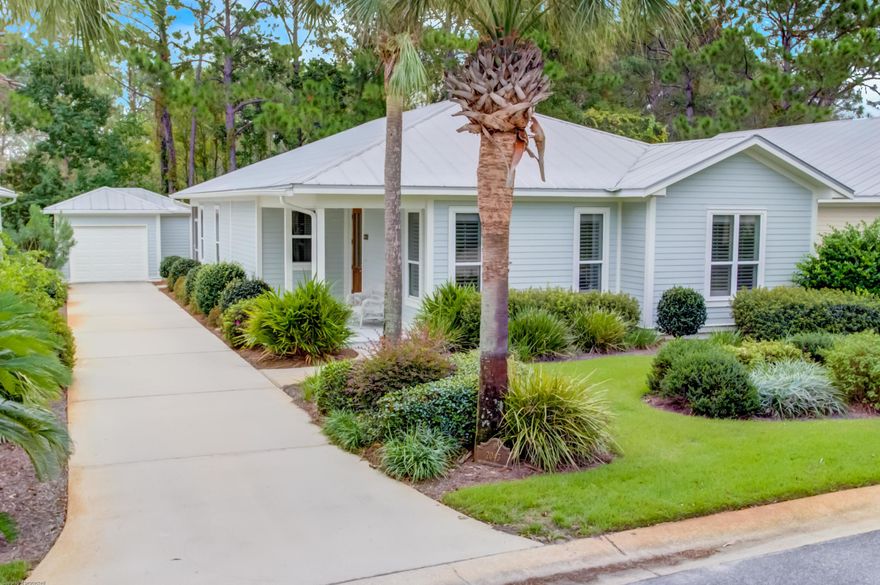 Charming cottage with a detached garage located on a large, well manicured lot offering a serene, natural backdrop view of the wooded conservation. Updates include a new fridge & microwave 2020, freshly painted 2019, and a new HVAC and water heater 2014. Nice open floorplan with the kitchen flowing into the dining/living combo and generously sized bedrooms! Hard surface flooring throughout with no carpet anywhere. Enjoy the cool winters cozied up by the gas fireplace or relax on the private, screened porch overlooking the natural surroundings. The master suite features private access to the screened porch, two walk-in closets, a double sink vanity and a walk-in shower. All of Crystal Lake is now short term rental restricted. Leases must be 6 months or longer.