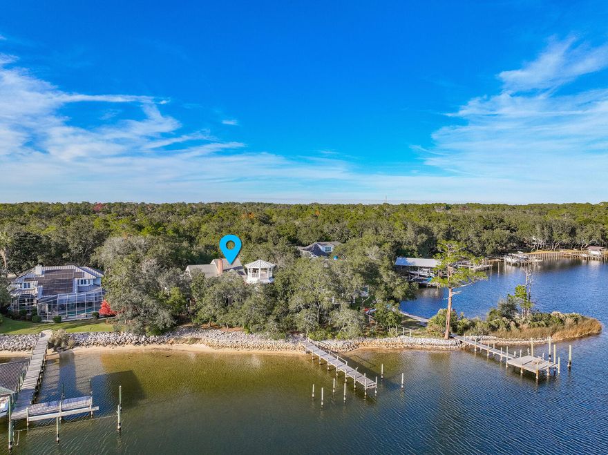 WATERFRONT home on a .8-acre lot with 146' on the protected deep water of Shirks Bayou with incredible views out towards the Choctawhatchee Bay. This one-owner home was custom built by Gary Miller Homes and was ''expanded'' in 1993 to include a unique ''tower'' built by Barton Homes. A long, private driveway leads you to this all brick home nestled in a low maintenance natural setting. When you enter this home through the foyer, you find yourself in the dining room that is open to the living room but what captures your eye is the graceful, floating, curved staircase leading to the upstairs! The raised ceiling in these rooms let in an abundance of natural light. Adjacent to these rooms is the eat-in kitchen that is open to the cozy family room that shares a two-sided fireplace with the liv room. The kitchen was updated in 2014 to include custom cabinets, granite counters and stainless appliances. Next to the family room is the "office tower" with a private entrance to the outside. On the other side of the house is the master suite with a luxurious bath that was updated in 2016 to include a soaking tub and separate shower. Upstairs you will find TWO additional bedroom suites, each with private baths and the upstairs "tower" room that has a variety of uses including a 4th bedroom! There is a door leading from the tower room to the "observation deck" on top of the tower. From here you have amazing sunset views over Shirks Bayou and out to the Choctawhatchee Bay. There is a large, multi-level paver patio along the rear of the house overlooking the natural back yard. A winding path leads you down to the seawall and deep water dock. Homes like this on protected deep water don't come on the market too often so don't miss out on your chance to make your waterfront dreams come true!!